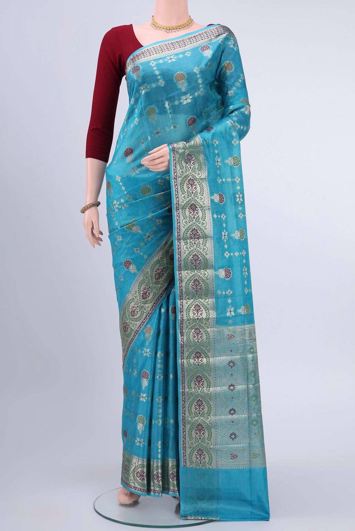 Blue Banarasi Raw Silk Saree with Zari And Thread Butta on the body and Zari Border displayed on a mannequin