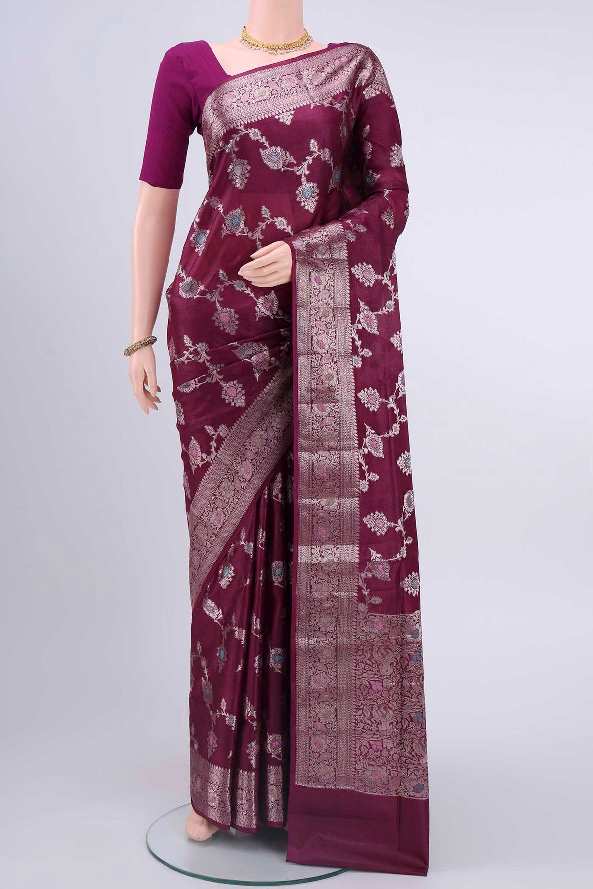 Light Magenta Banarasi Raw Silk Saree with Zari And Thread Butta on the body and Zari Border displayed on a mannequin