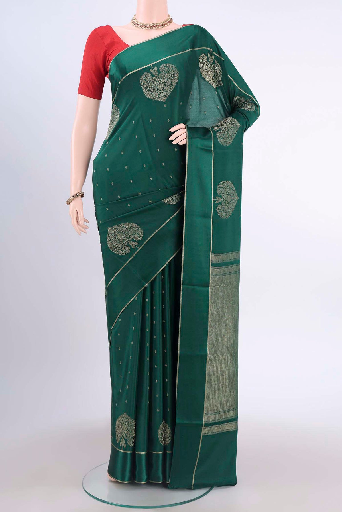 Bottle Green Mysore Crepe Saree with Zari Butta on the body and Thin Zari Line displayed on a mannequin
