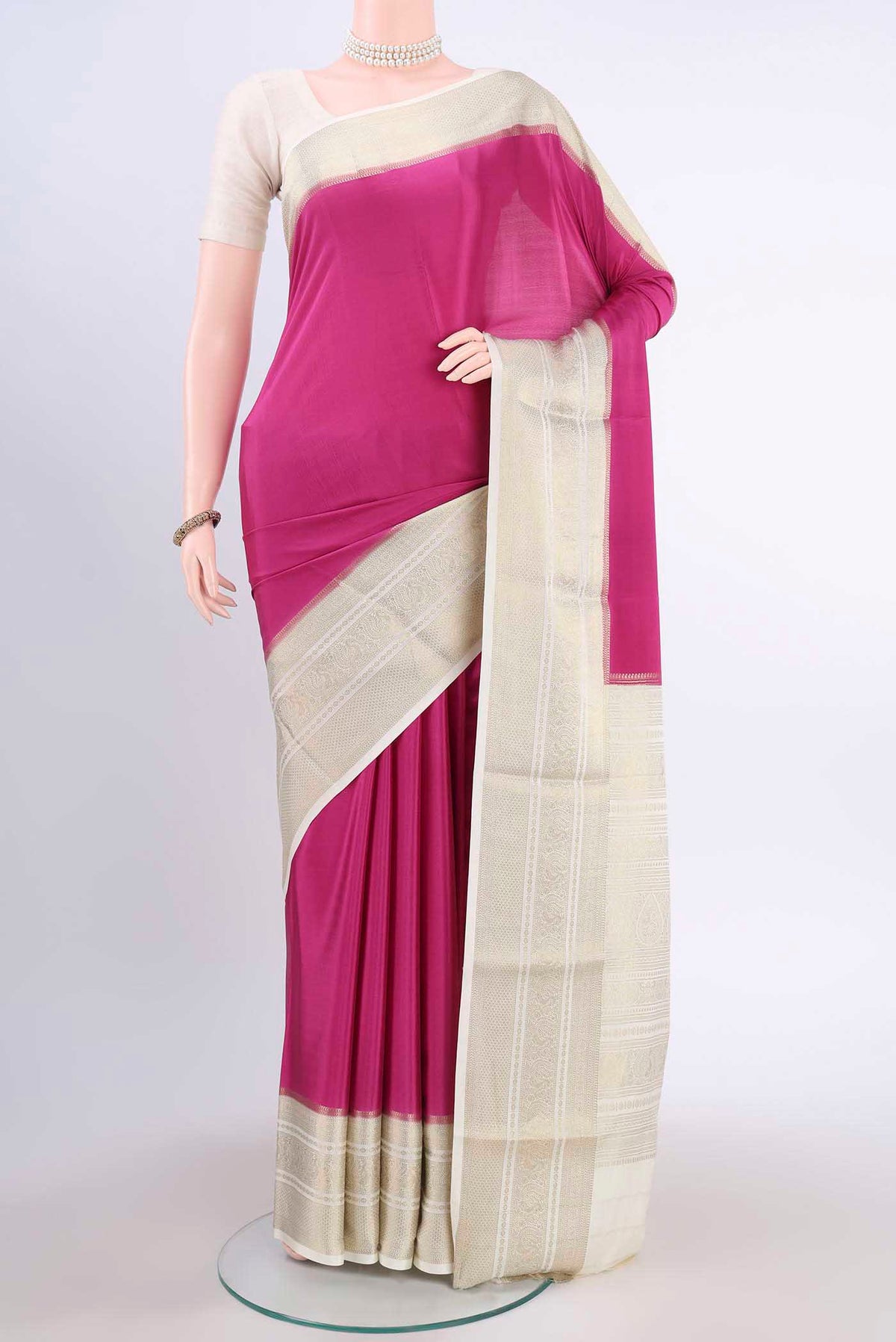 Light Magenta Mysore Crepe Saree with Plain Body and Zari Border displayed on a mannequin