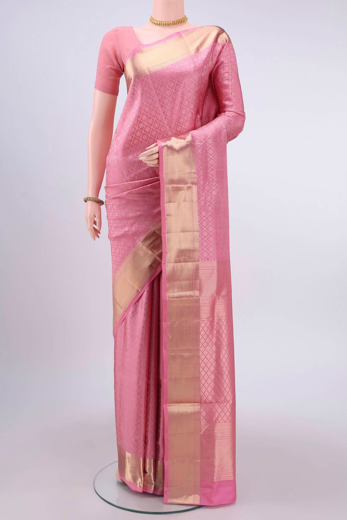 Rose pink Soft Silk Saree with Zari Brocade on the body and Zari Border displayed on a mannequin