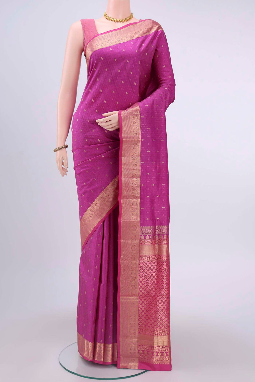 Magenta Soft Silk Saree with Jacquard With Zari Butta on the body and Zari Border displayed on a mannequin