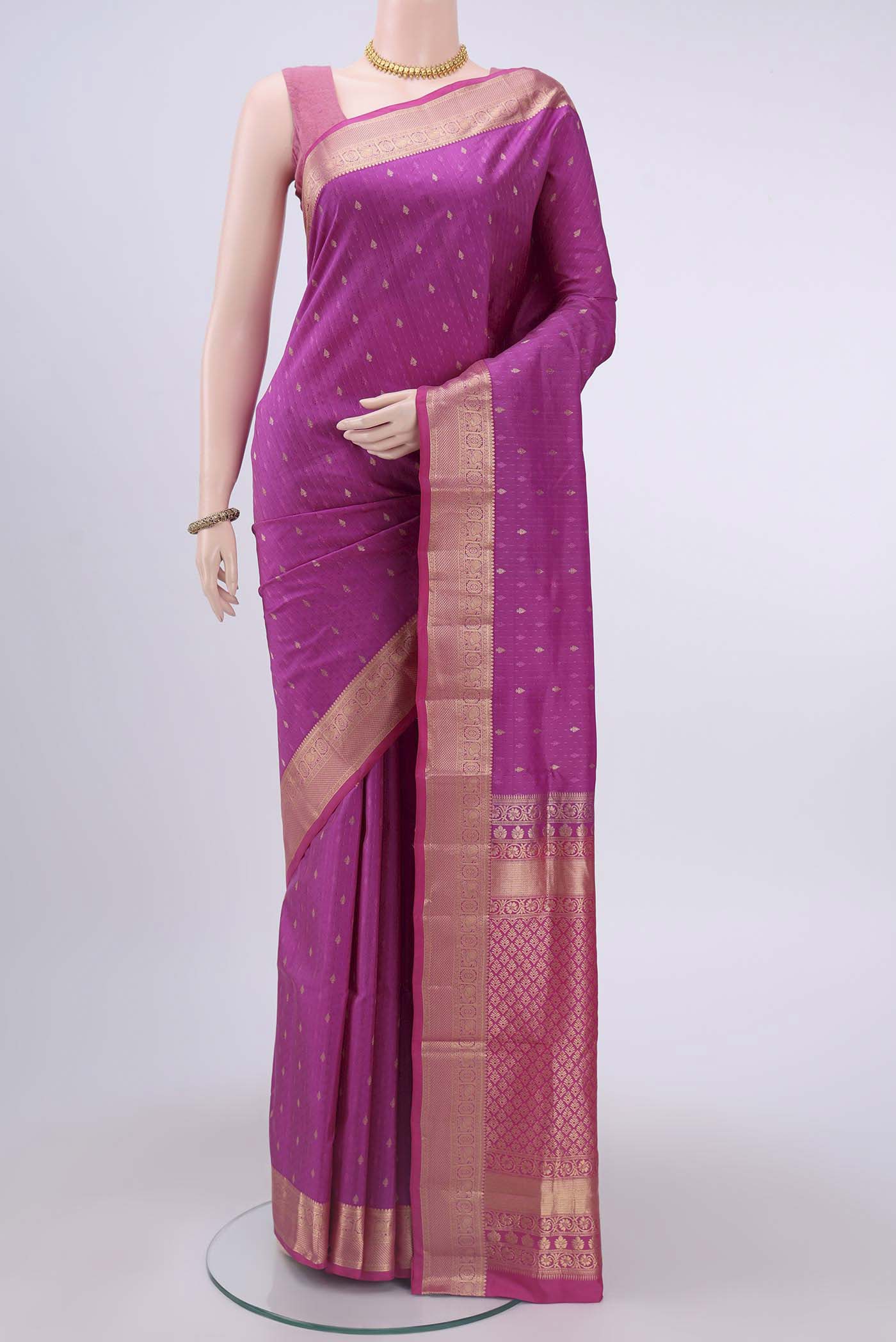 Magenta Soft Silk Saree with Jacquard With Zari Butta on the body and Zari Border displayed on a mannequin