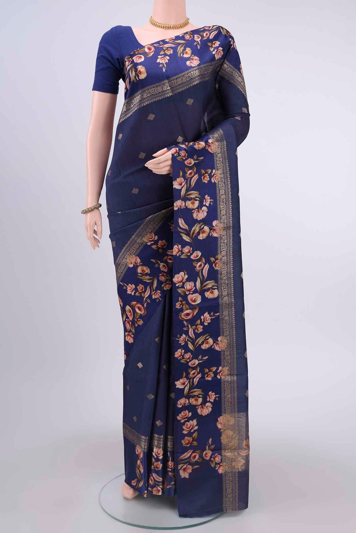 Navy Blue Tussar Silk Saree with Zari Butta on the body and Printed Border displayed on a mannequin