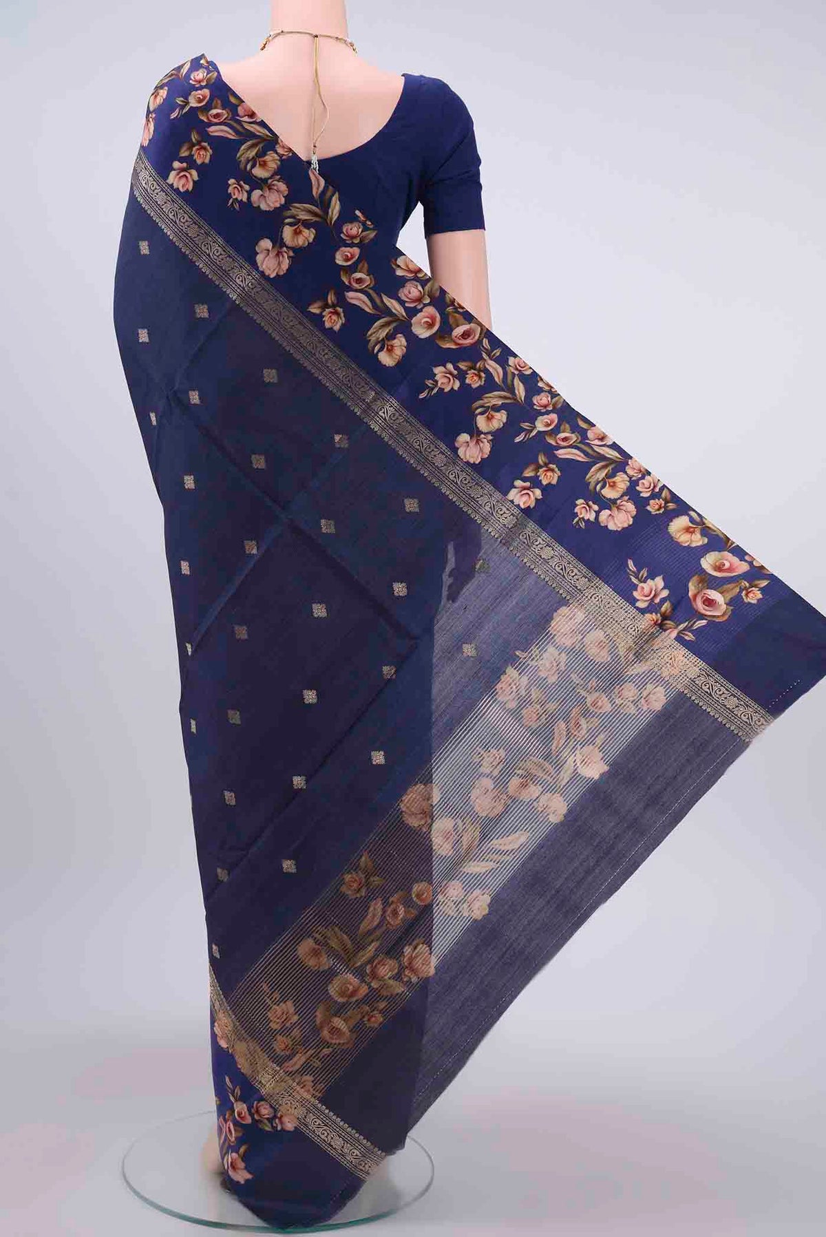 Flat view of Navy Blue Tussar Silk Saree with Zari Butta on the body and Printed Border