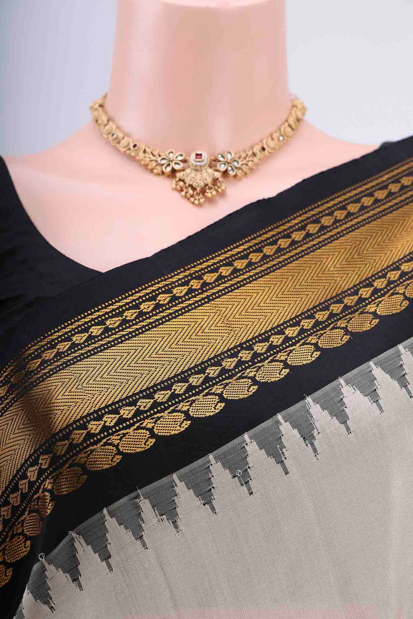 Border image of Beige Gadwal Silk Saree with Zari And Thread Butta on the body and Zari Border