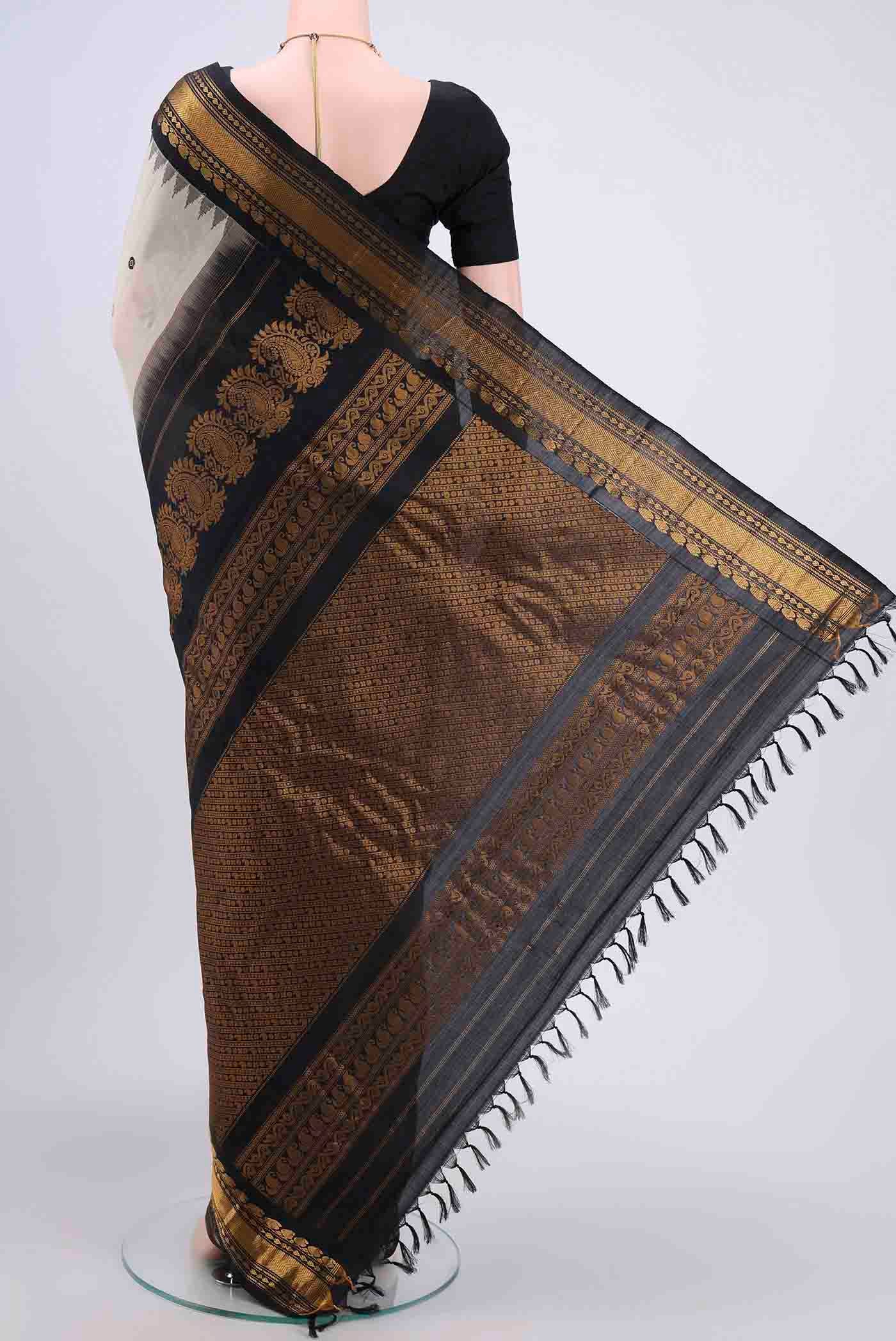 Flat view of Beige Gadwal Silk Saree with Zari And Thread Butta on the body and Zari Border