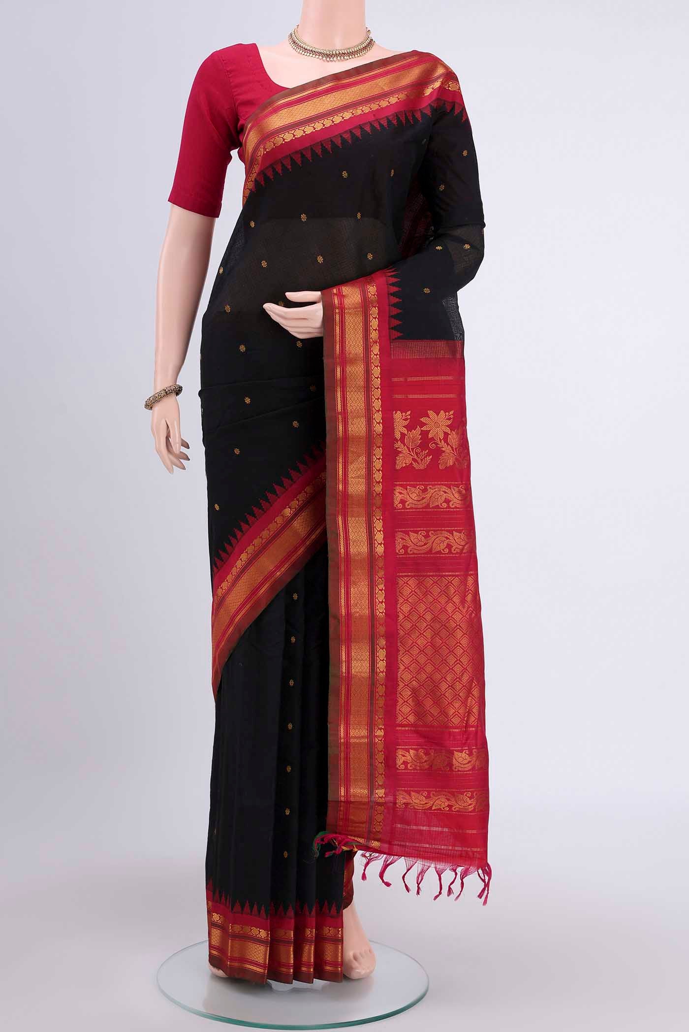Black Gadwal Silk Saree with Zari Butta on the body and Zari Border displayed on a mannequin