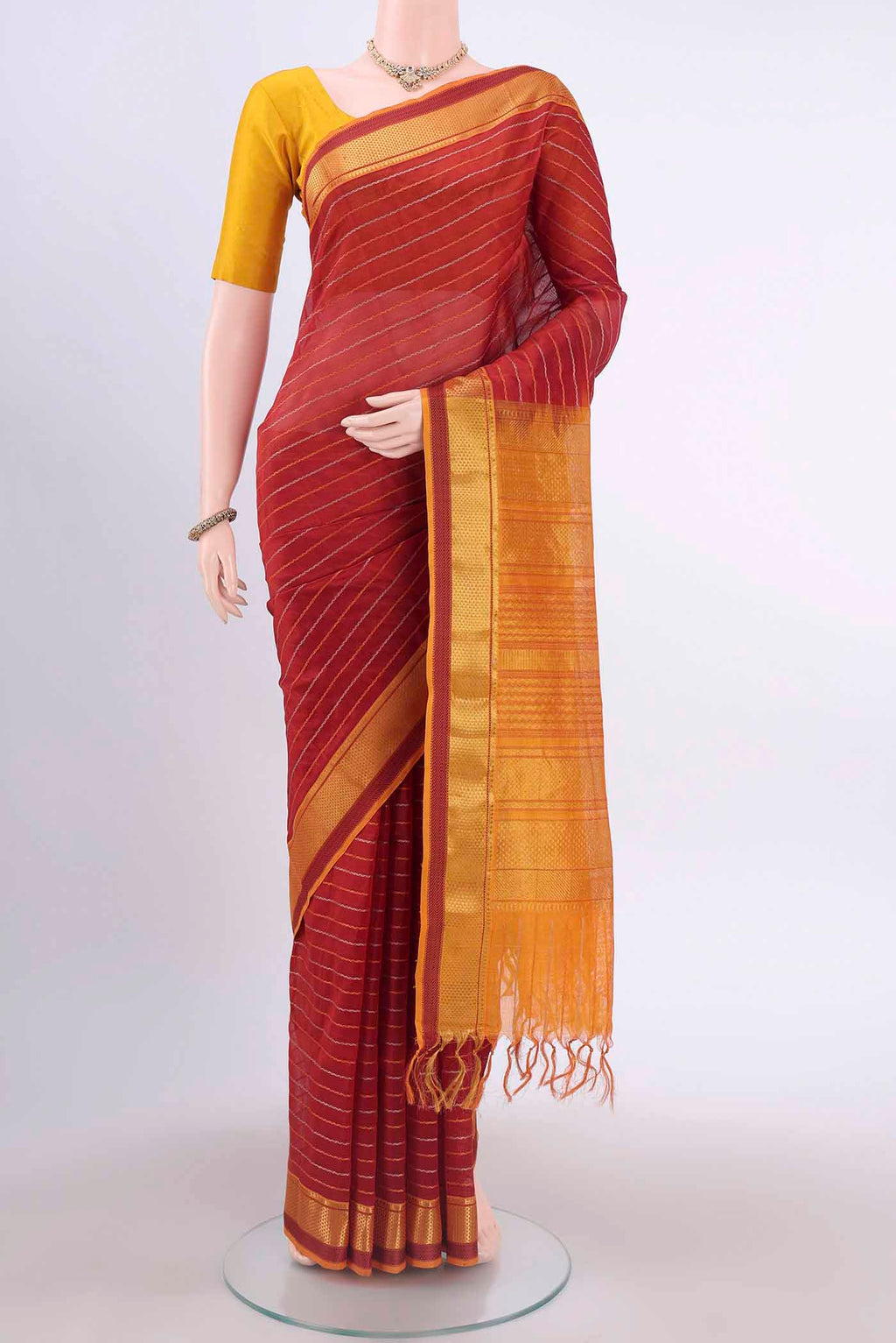 Maroon Silk Cotton Saree with Veldhari on the body and Zari Border displayed on a mannequin