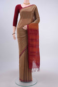 Beige Coimbatore Silk Cotton Saree with Checked design on the body and Plain Border displayed on a mannequin