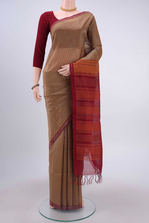Beige Coimbatore Silk Cotton Saree with Checked design on the body and Plain Border displayed on a mannequin