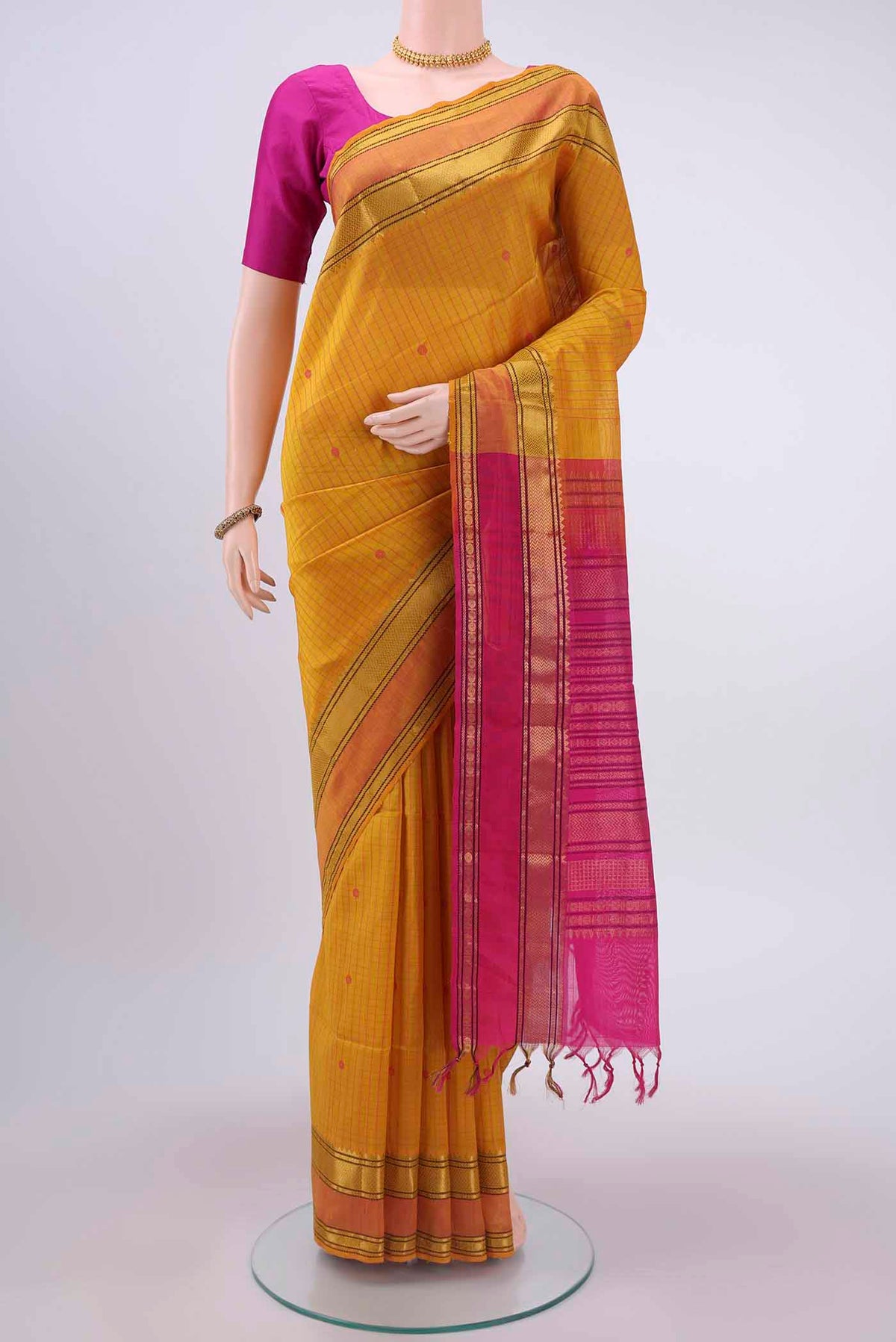Yellow Blended Coimbatore Silk Cotton Saree with Checked design on the body and Zari Border displayed on a mannequin