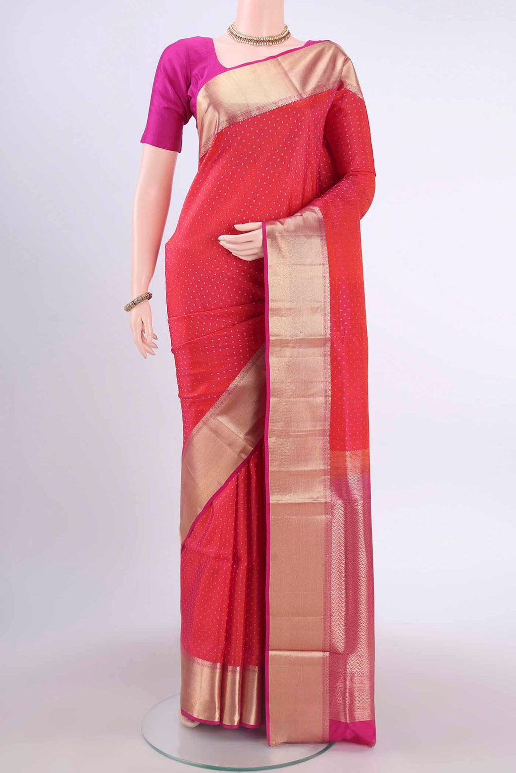 Pure Silk Pure Zari Dark Pink Soft Saree with Zari Butta on the body and Zari Border displayed on a mannequin