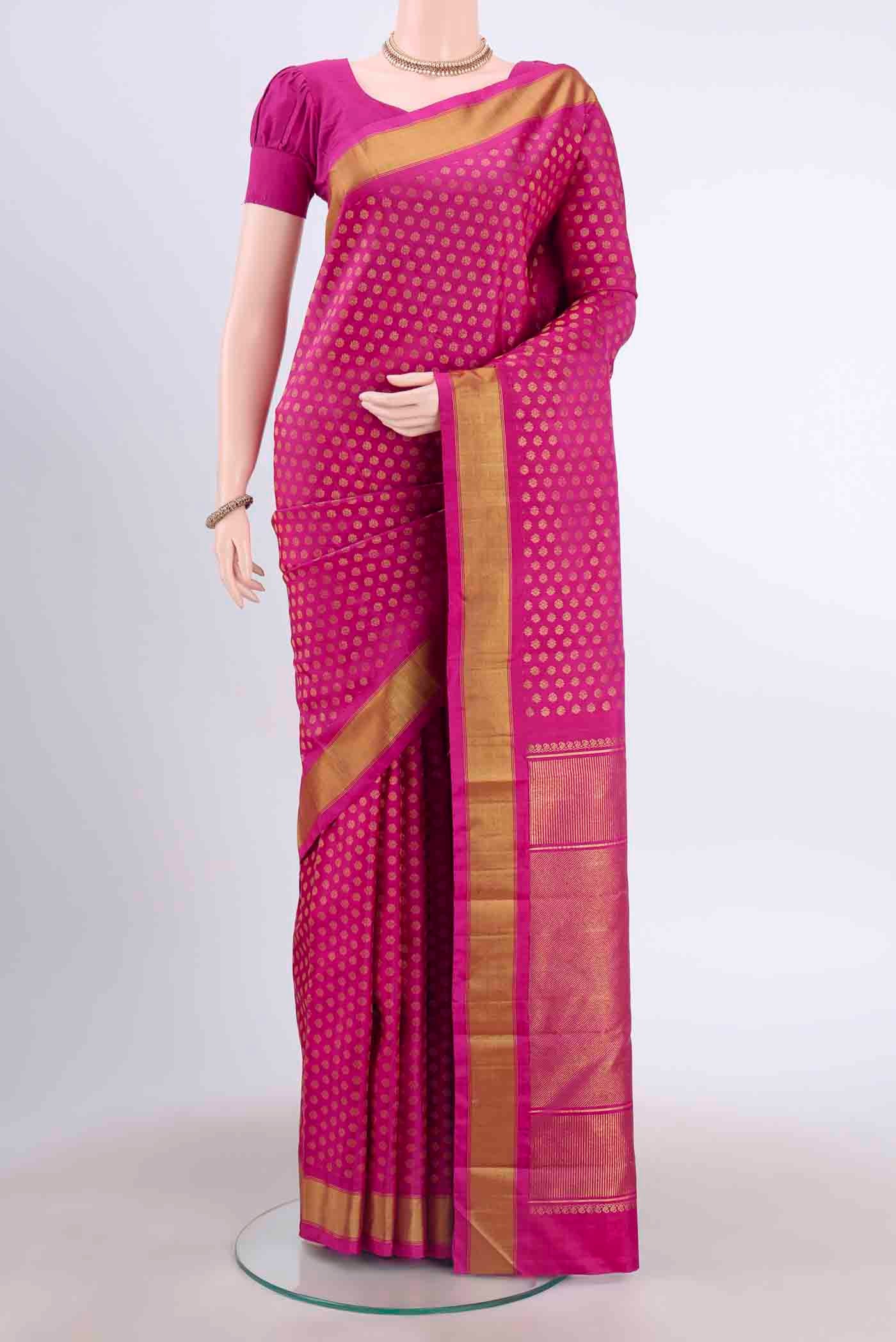 Pure Silk Pure Zari Maroon Kanchipuram Saree with Zari Butta on the body and Zari Border displayed on a mannequin