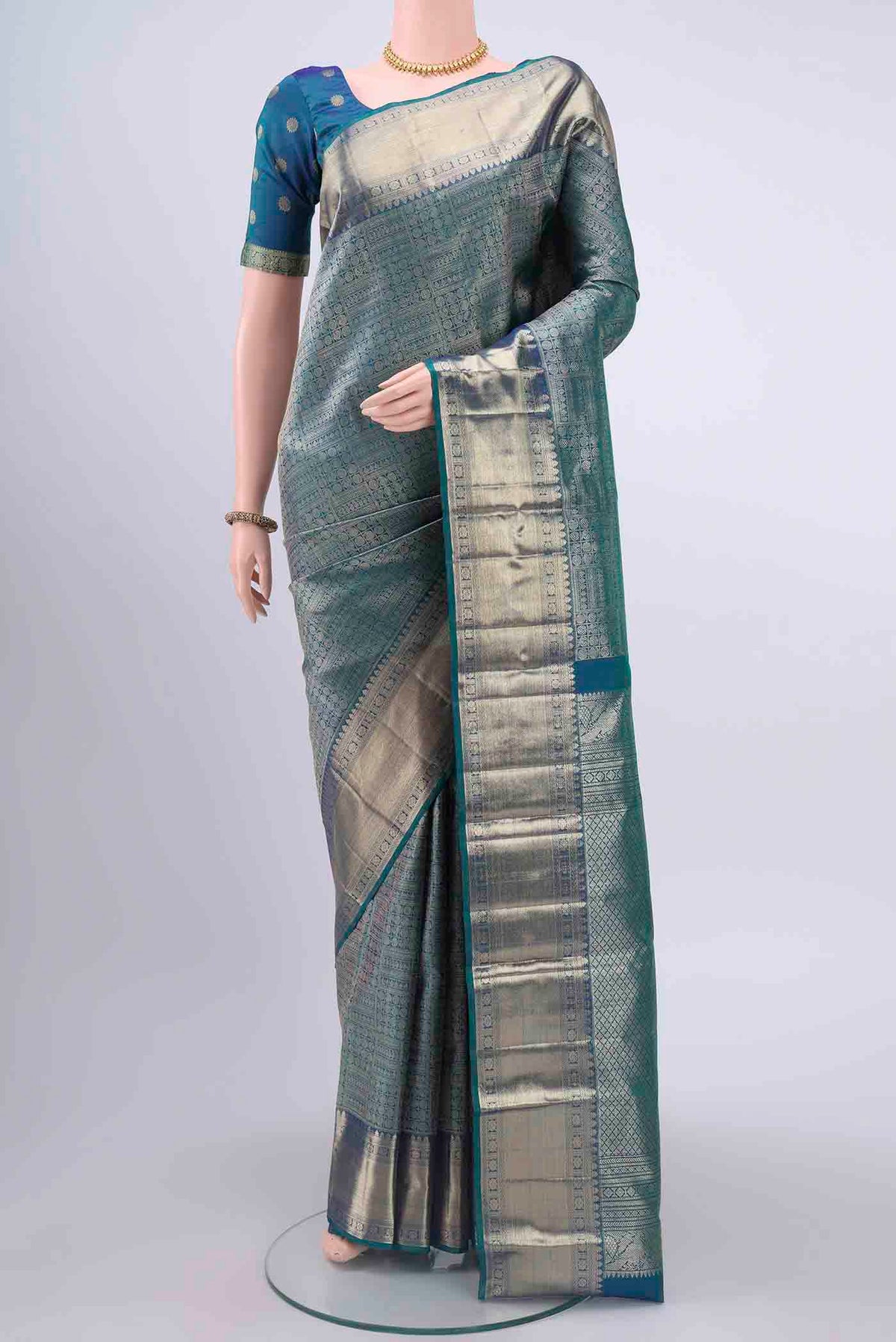 Blue Kanchipuram Saree with Zari Brocade on the body and Zari Border displayed on a mannequin