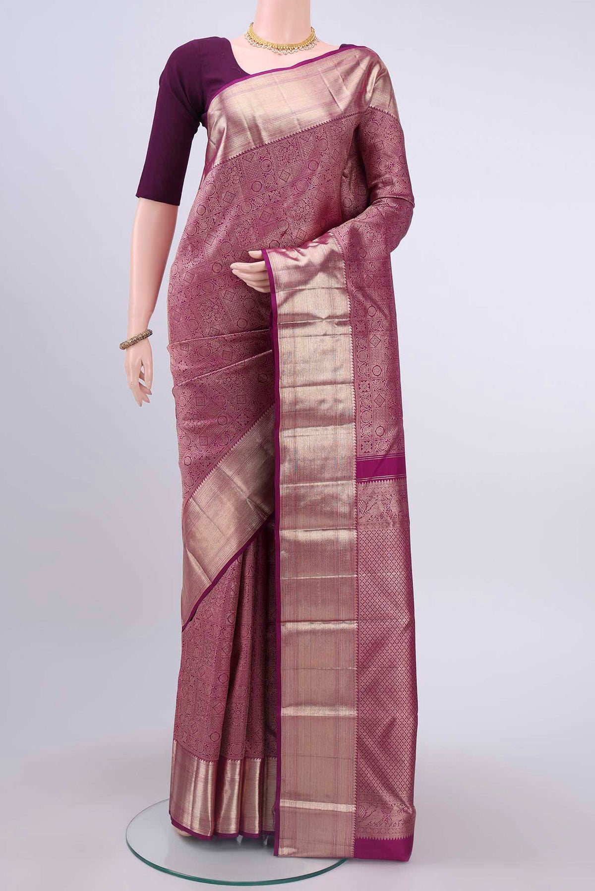 Purple Kanchipuram Saree with Zari Brocade on the body and Zari Border displayed on a mannequin