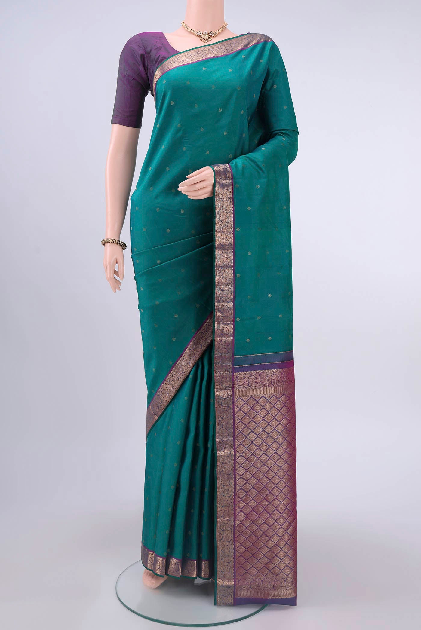 Sea Green Nangavalli Silk [ Salem ] Saree with Zari Butta on the body and Zari Border displayed on a mannequin