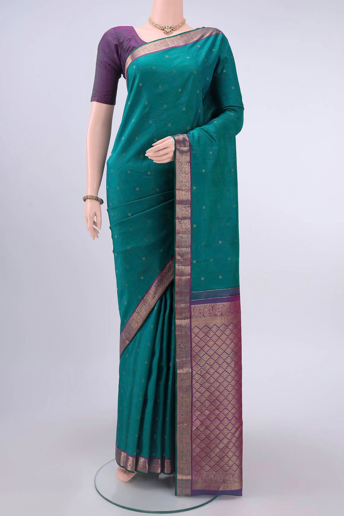 Sea Green Nangavalli Silk [ Salem ] Saree with Zari Butta on the body and Zari Border displayed on a mannequin