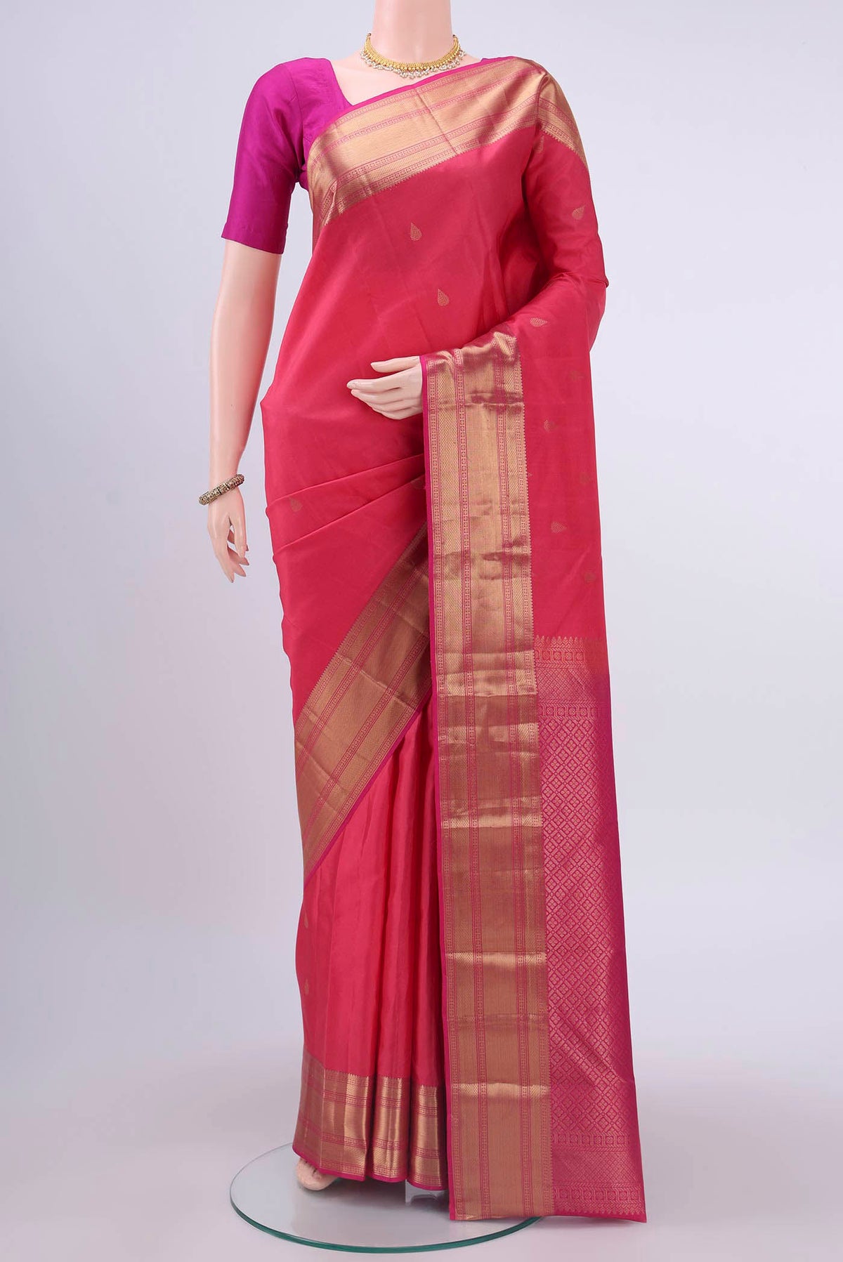 Pink Nangavalli Silk [ Salem ] Saree with Zari Butta on the body and Zari Border displayed on a mannequin