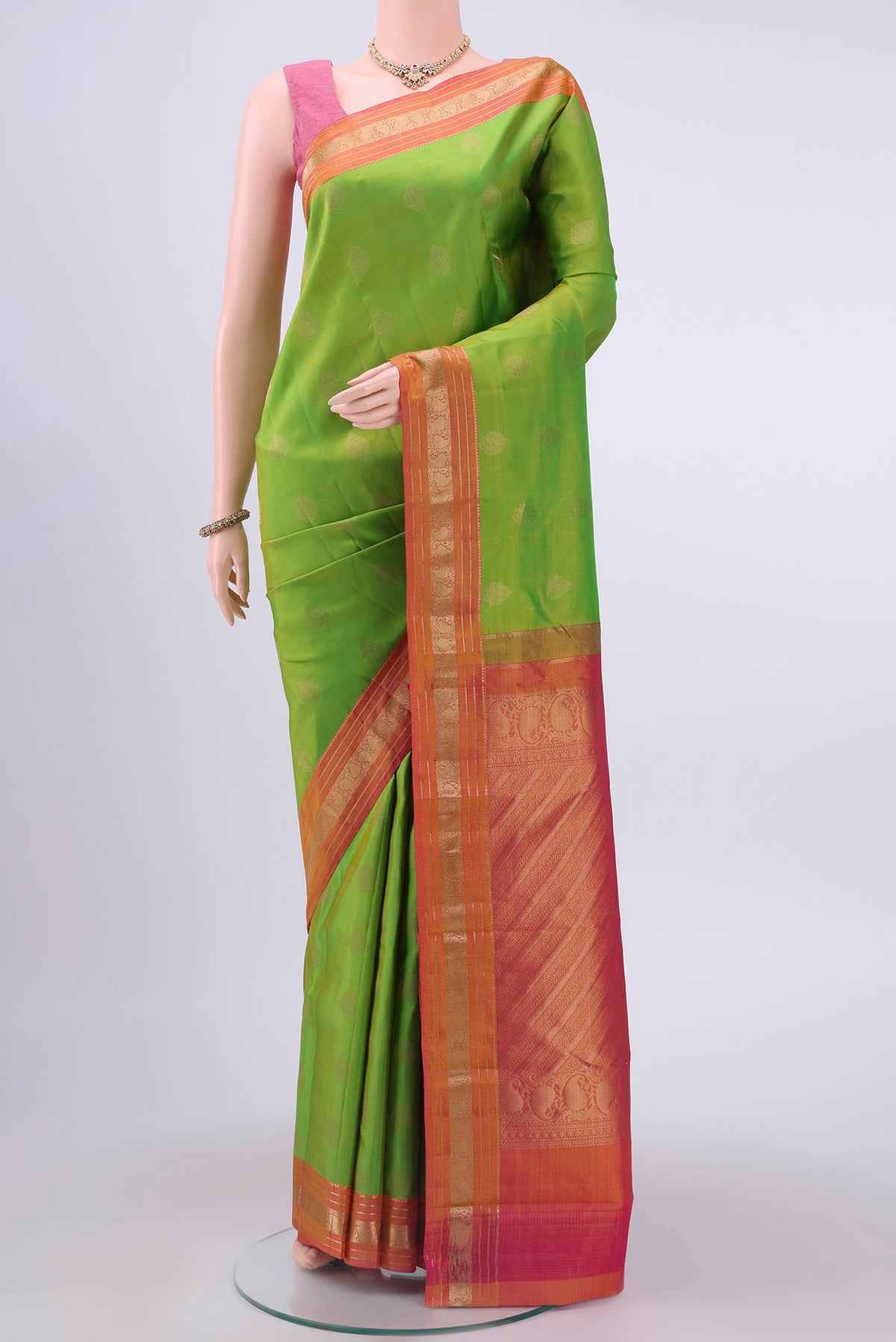 Parrot Green Dual Tone Nangavalli Silk [ Salem ] Saree with Zari Butta on the body and Ganga Jamuna Border displayed on a mannequin