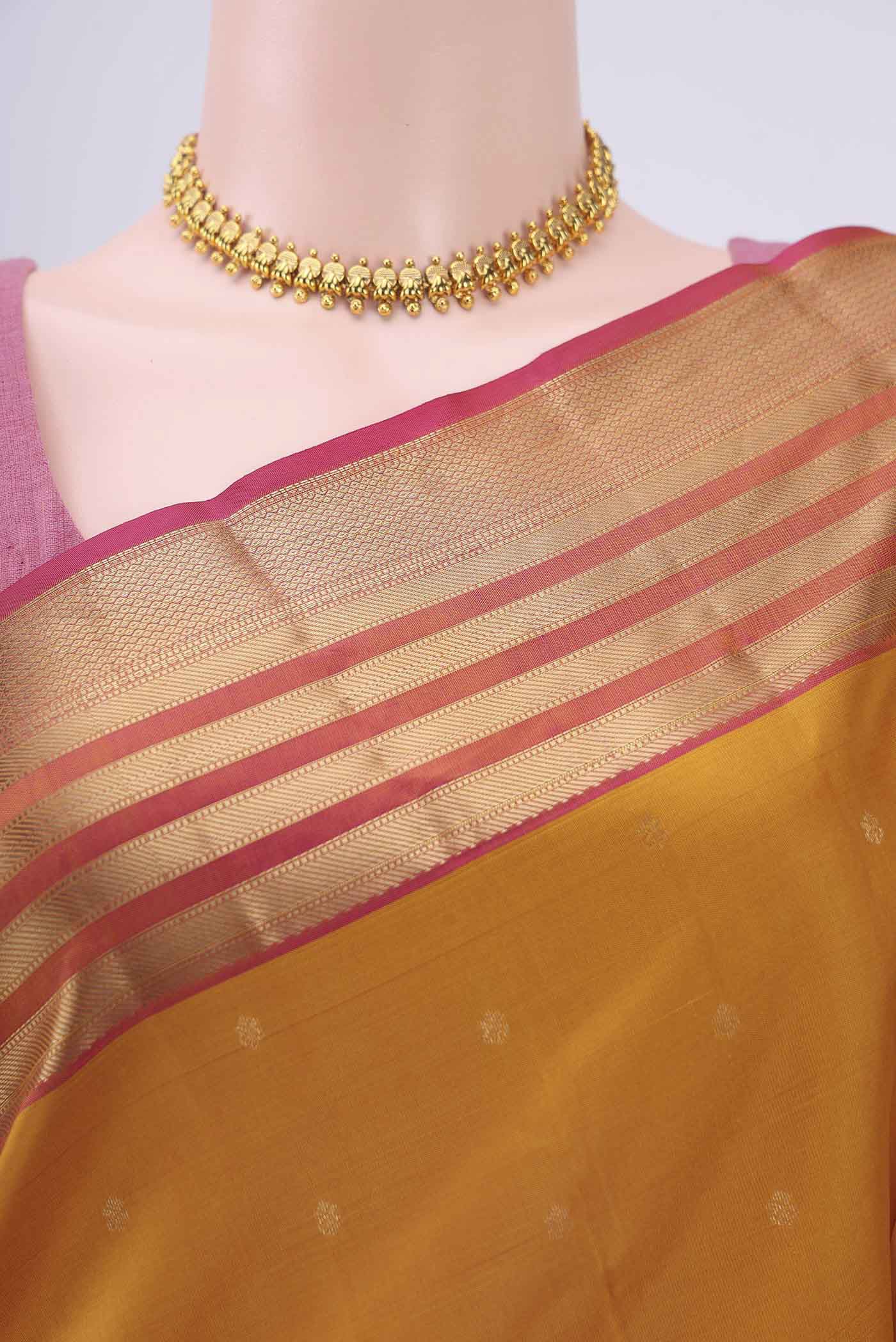 Border image of Mustard Dual Tone Nangavalli Silk [ Salem ] Saree with Zari Butta on the body and Zari Border