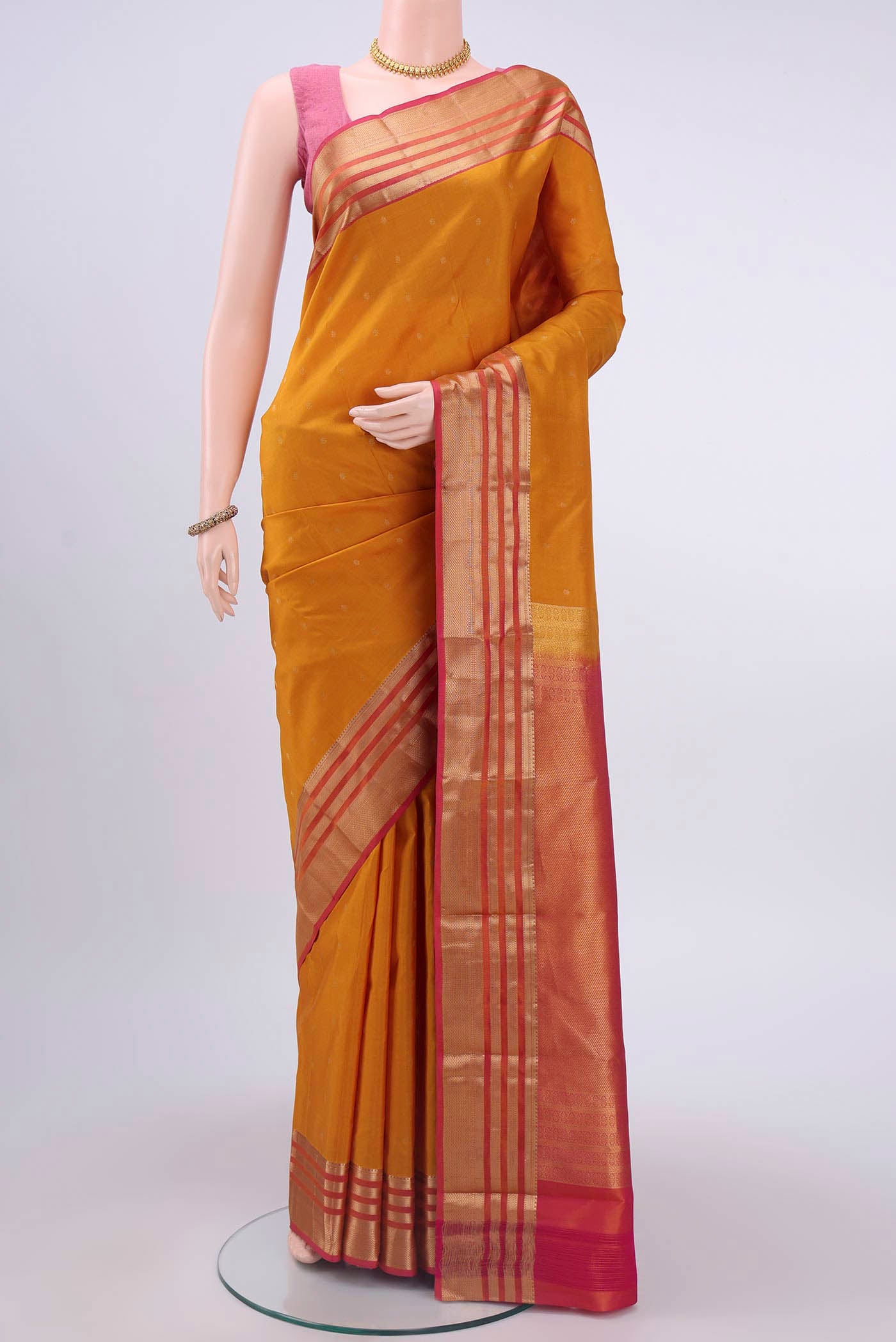 Mustard Dual Tone Nangavalli Silk [ Salem ] Saree with Zari Butta on the body and Zari Border displayed on a mannequin