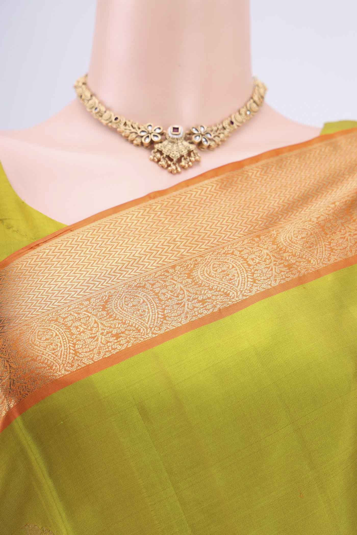 Border image of Light Green Soft Silk Saree with Zari Butta on the body and Zari Border. 
