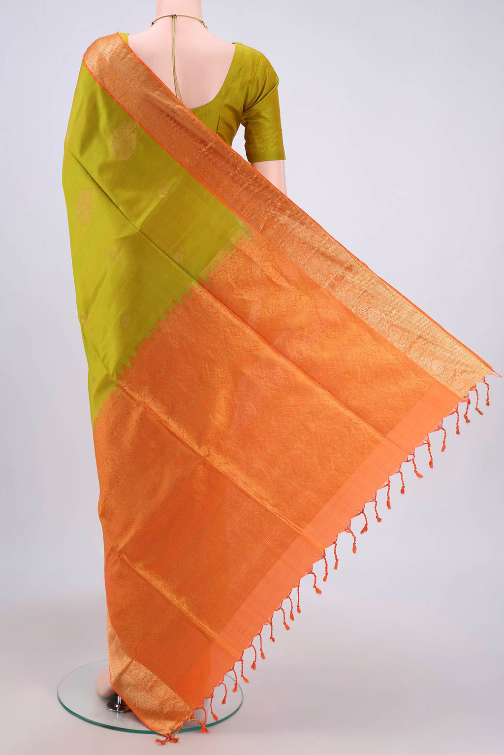 Flat view of Light Green Soft Silk Saree with Zari Butta on the body and Zari Border. 