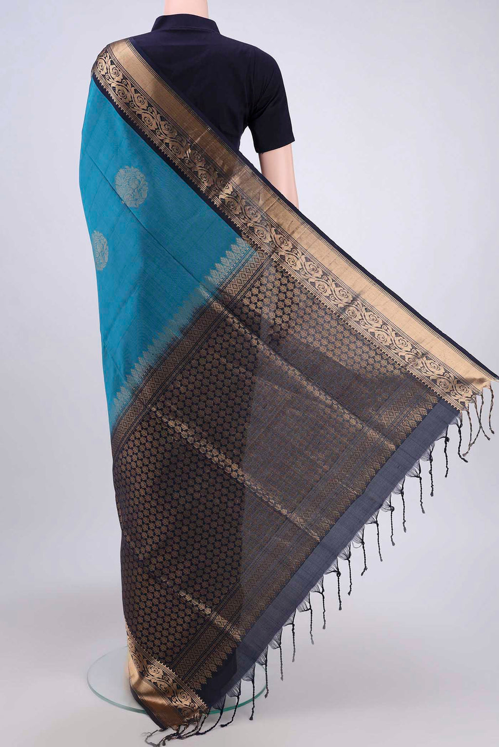 Flat view of Blue Soft Silk Saree with Zari Butta on the body and Zari Border. 