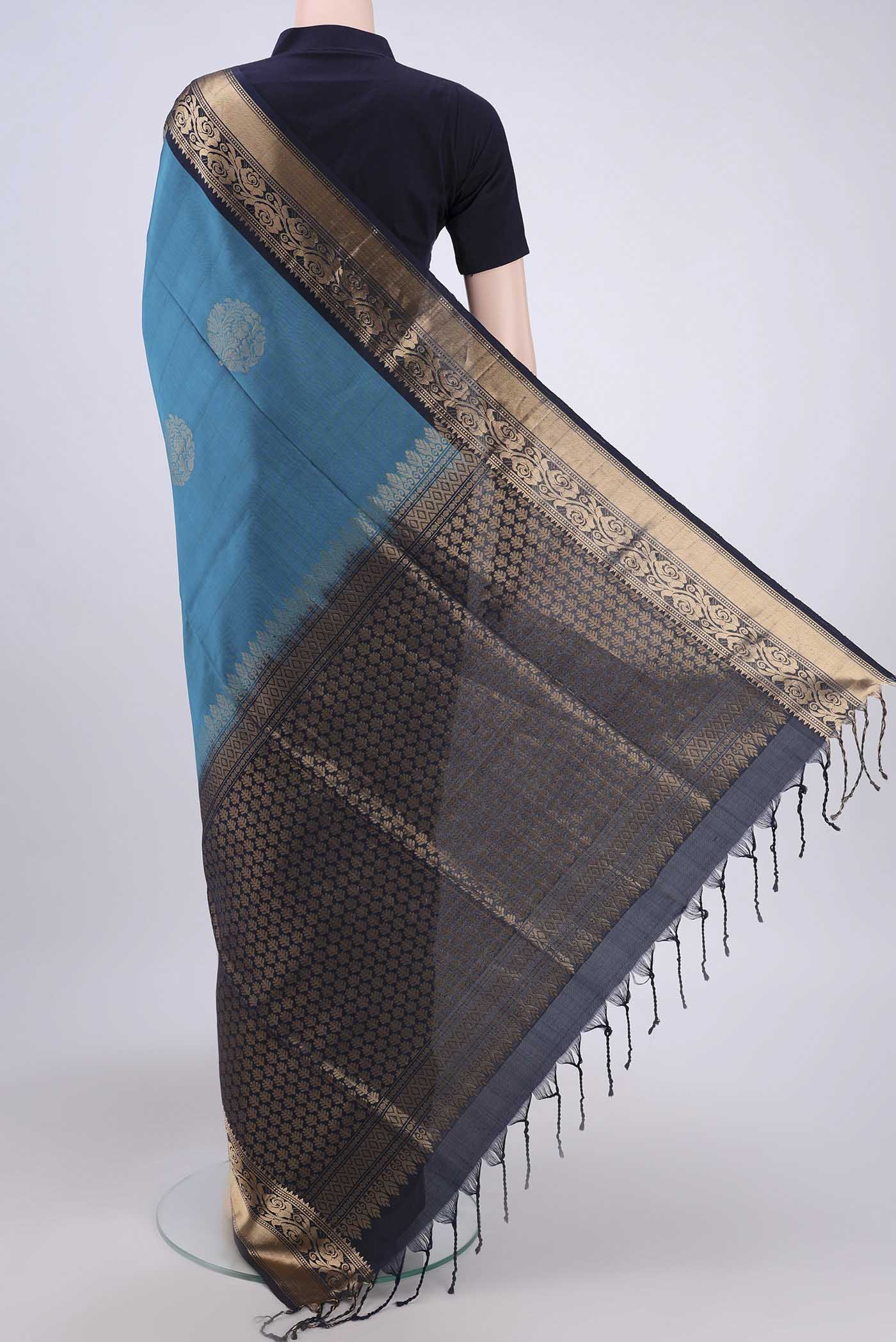 Flat view of Blue Soft Silk Saree with Zari Butta on the body and Zari Border. 