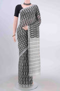 Black Tussar Silk Saree with Floral Print on the body and Thread Border displayed on a mannequin