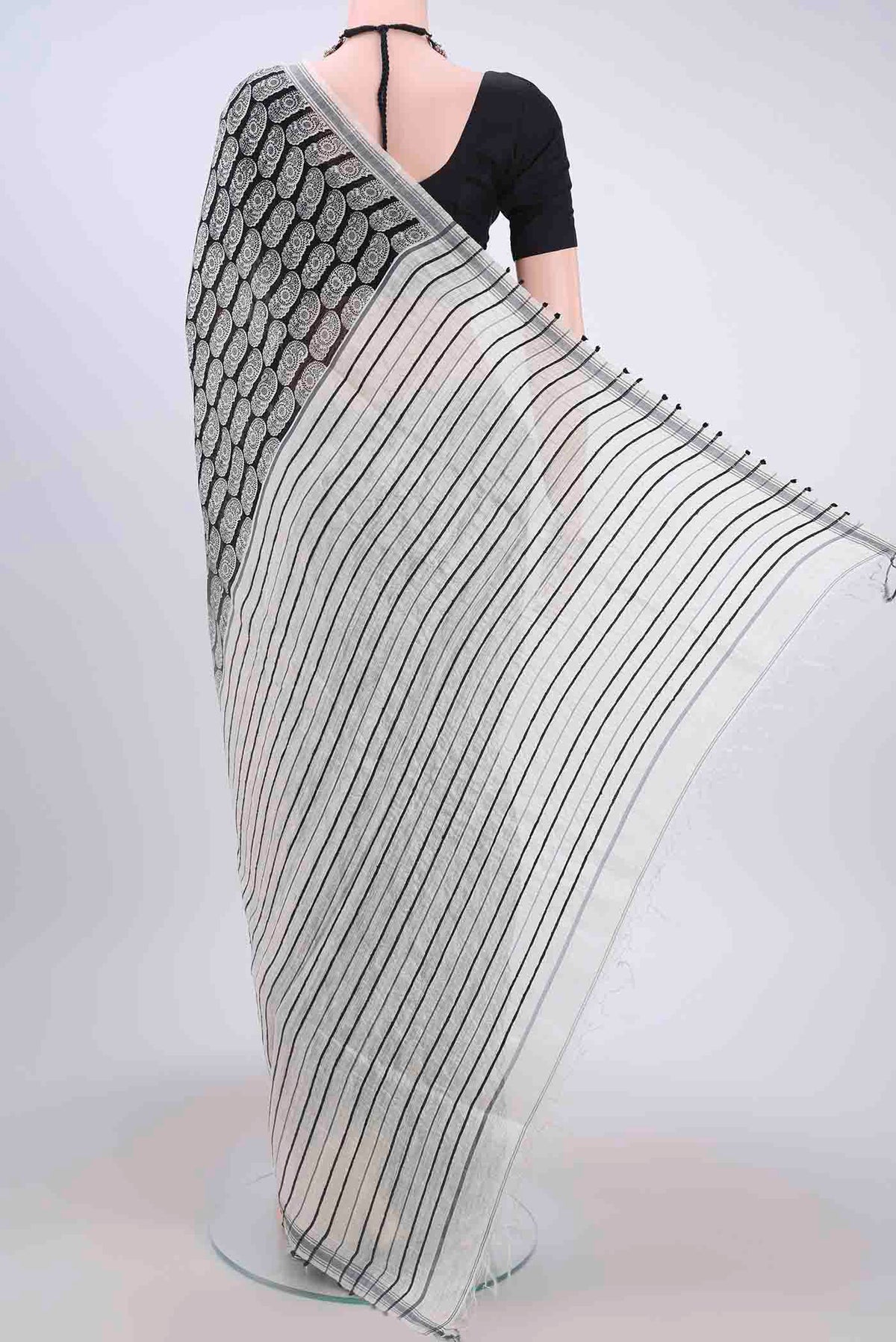 Flat view of Black Tussar Silk Saree with Floral Print on the body and Thread Border