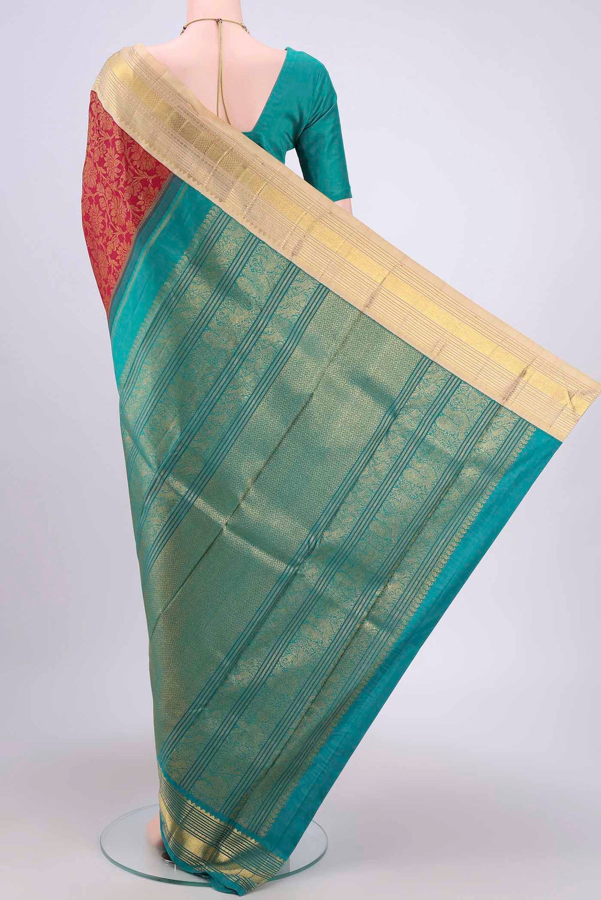 Flat view of Maroon Kanjivaram Silk Saree with Plain Body and Ganga Jamuna Border. 