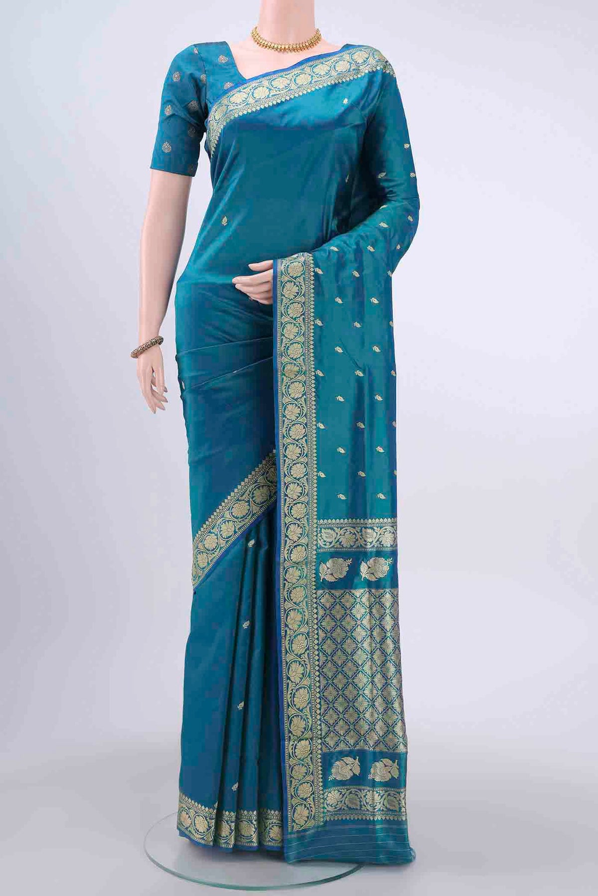 Dark Blue Dual Tone Banarasi Katan Silk Saree with Thread Butta on the body and Thread Border displayed on a mannequin