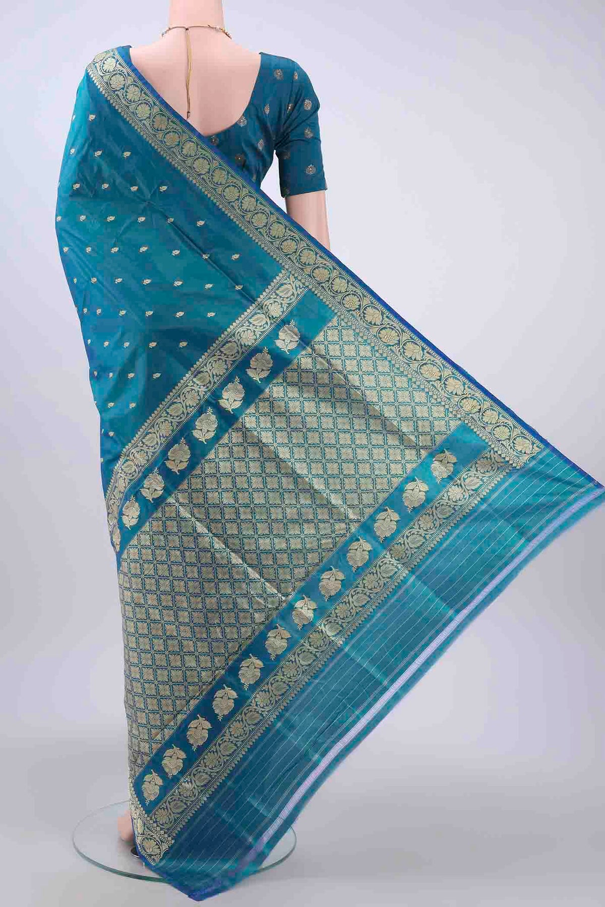 Flat view of Dark Blue Dual Tone Banarasi Katan Silk Saree with Thread Butta on the body and Thread Border