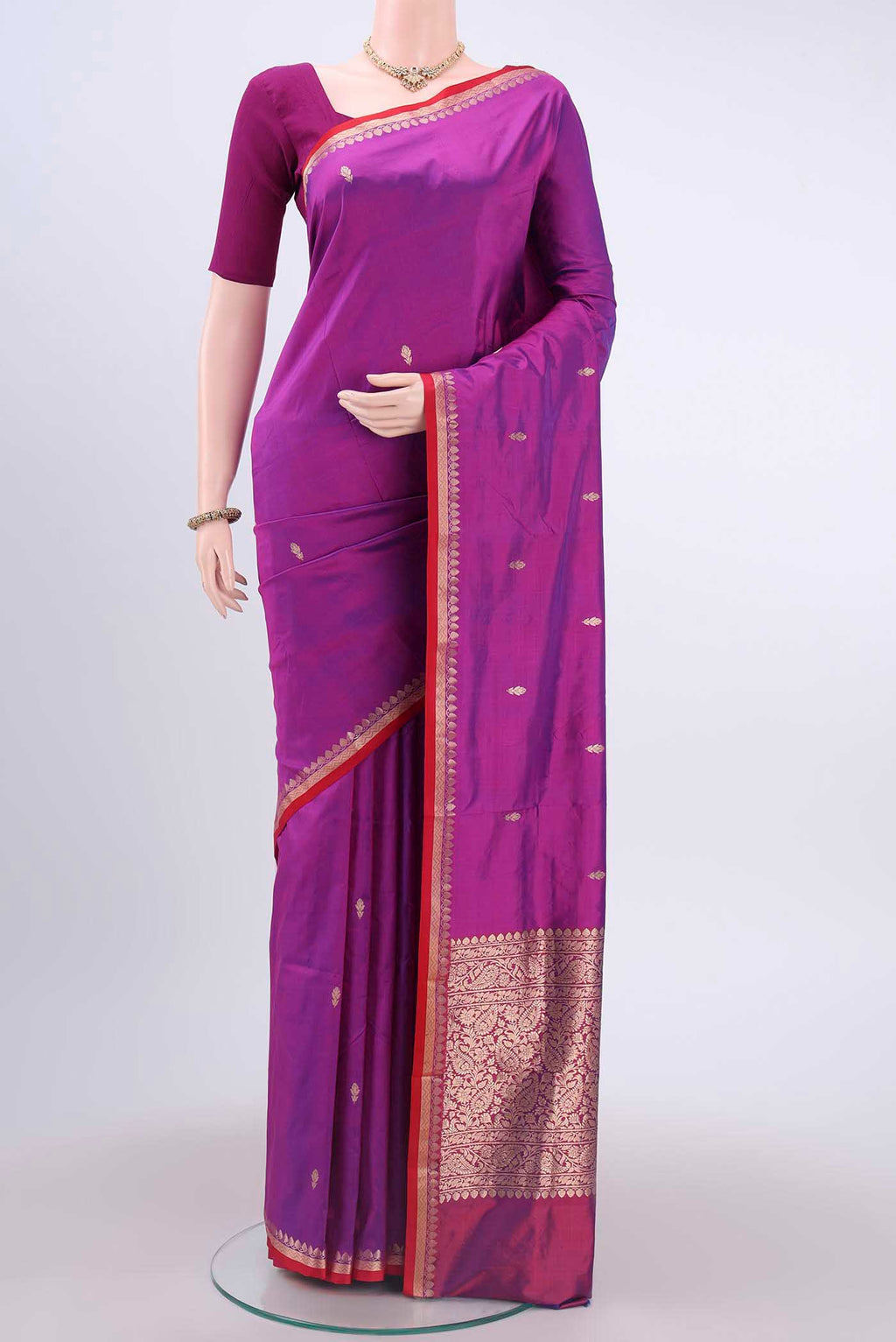 Magenta Dual Tone Banarasi Katan Silk Saree with Zari Butta on the body and Zari Border displayed on a mannequin