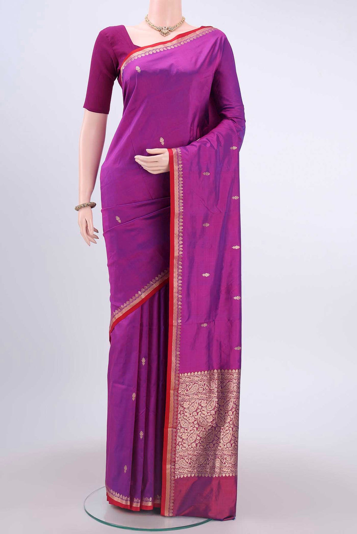 Magenta Dual Tone Banarasi Katan Silk Saree with Zari Butta on the body and Zari Border displayed on a mannequin