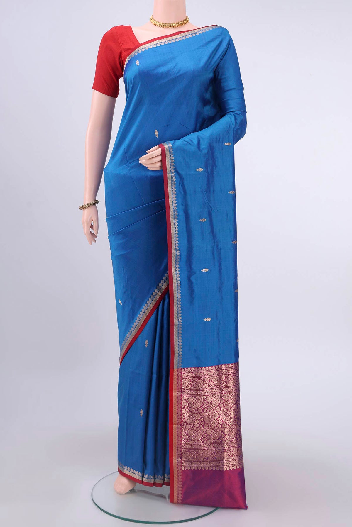 Blue Dual Tone Banarasi Katan Silk Saree with Zari Butta on the body and Zari Border displayed on a mannequin