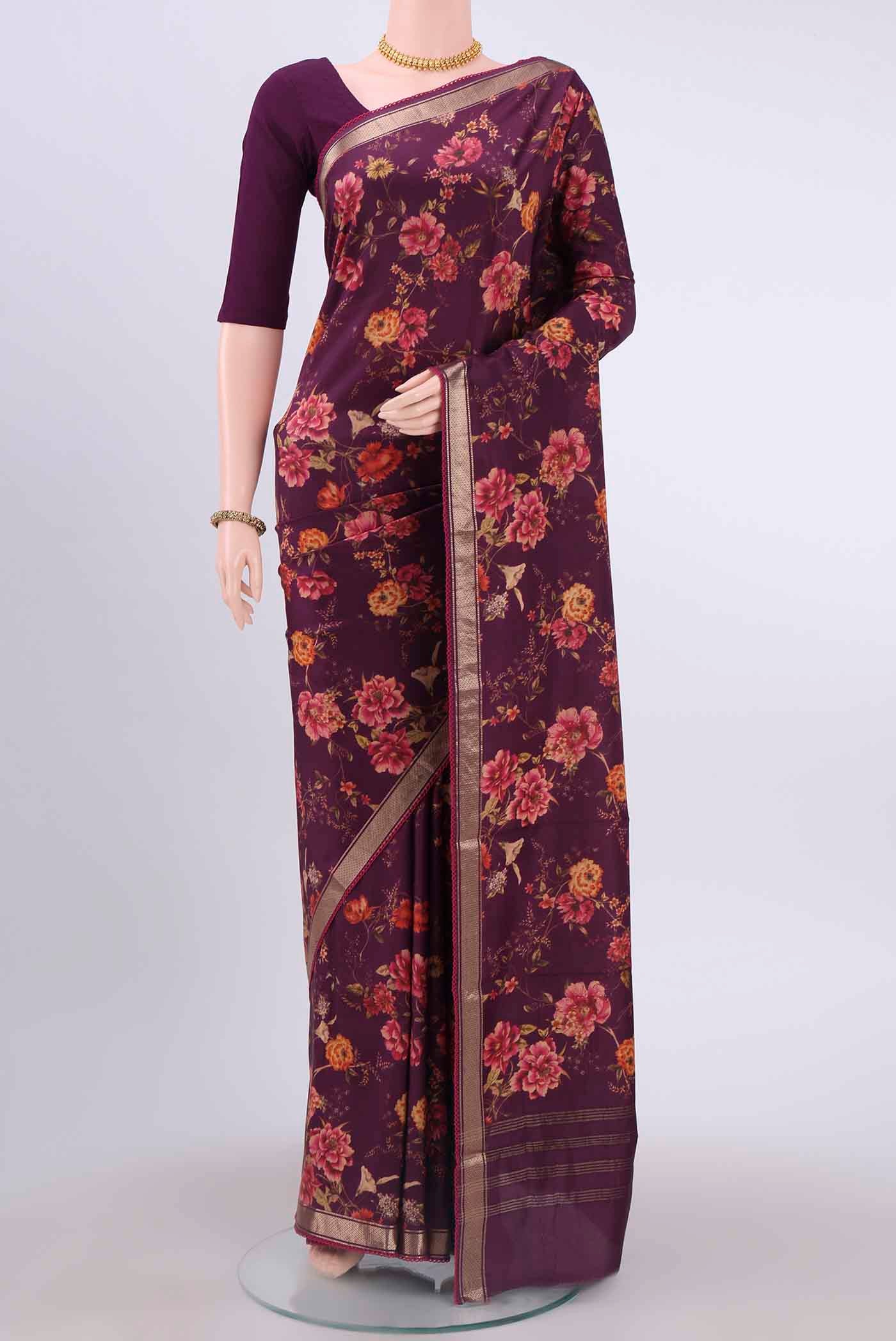 Burgundy Printed Silk Saree with Floral Print on the body and Zari Border displayed on a mannequin