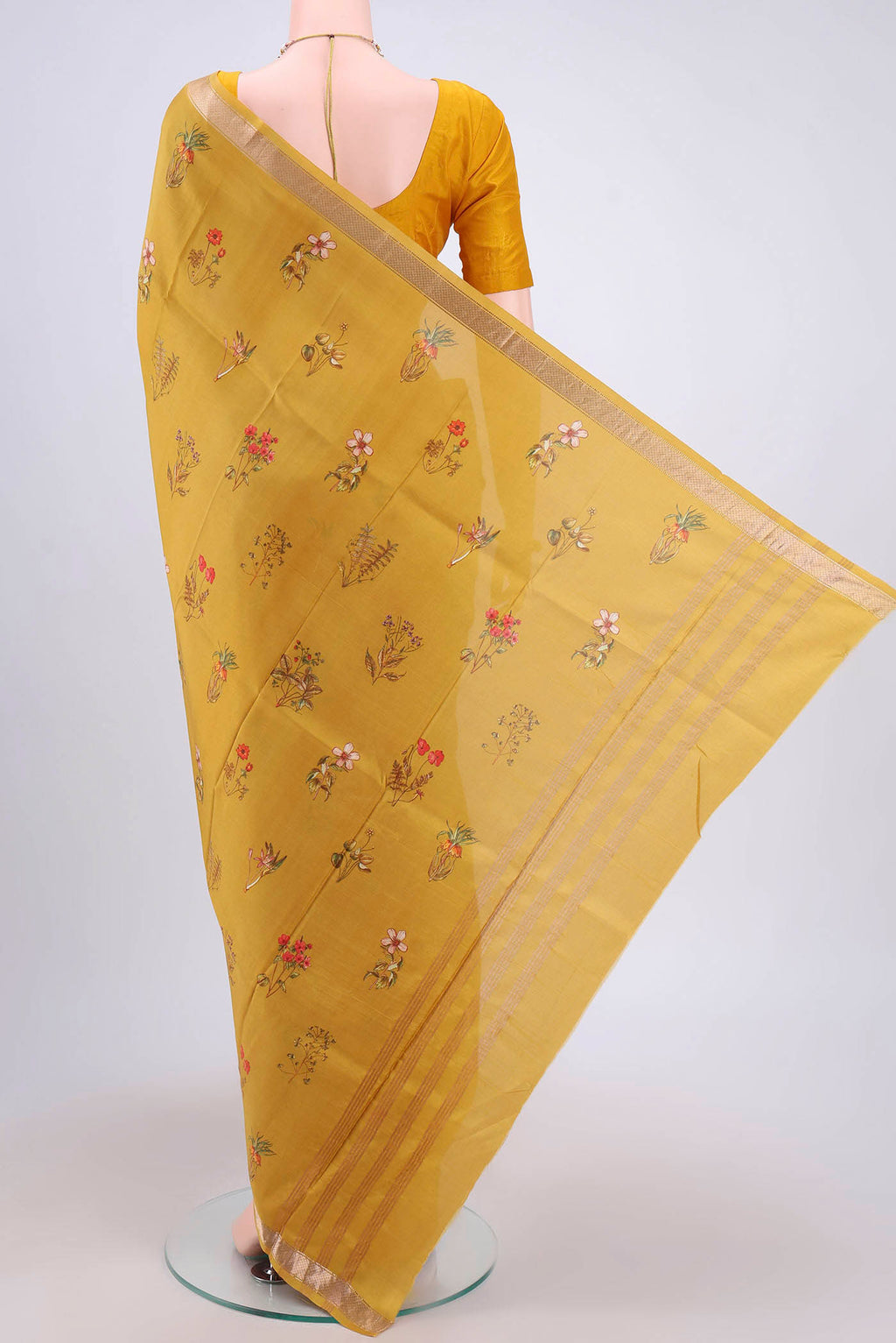 Flat view of Mustard Mysore Crepe Saree with Floral Print on the body and Zari Border. 