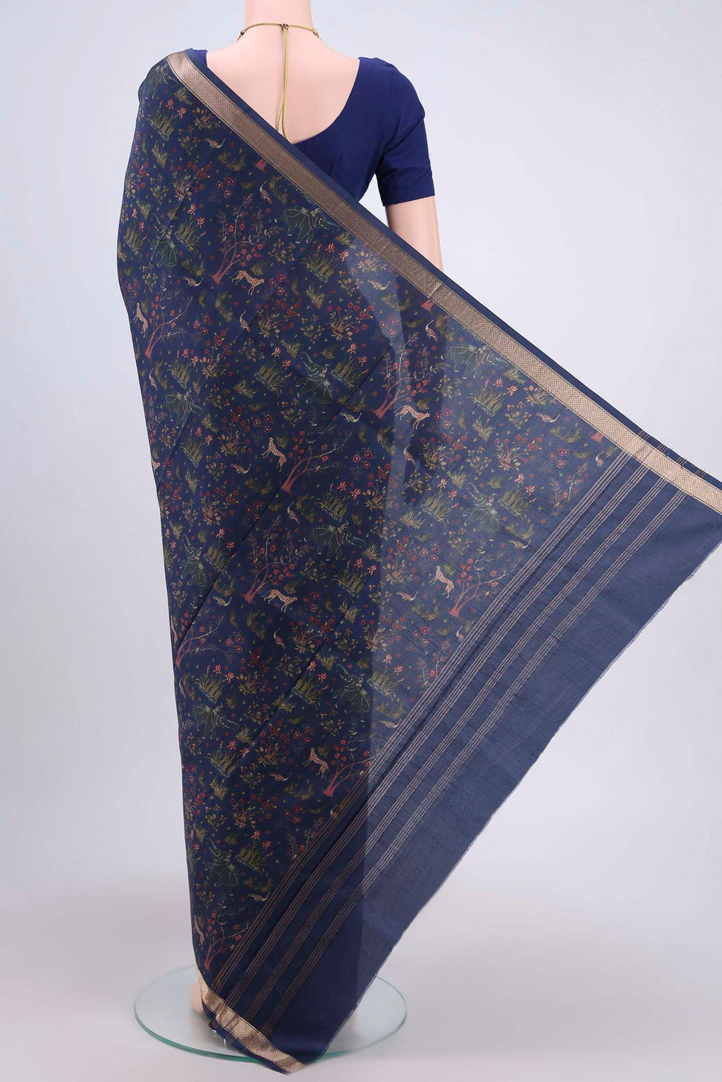 Flat view of Navy Blue Printed Silk Saree with Printed design on the body and Printed Border. 