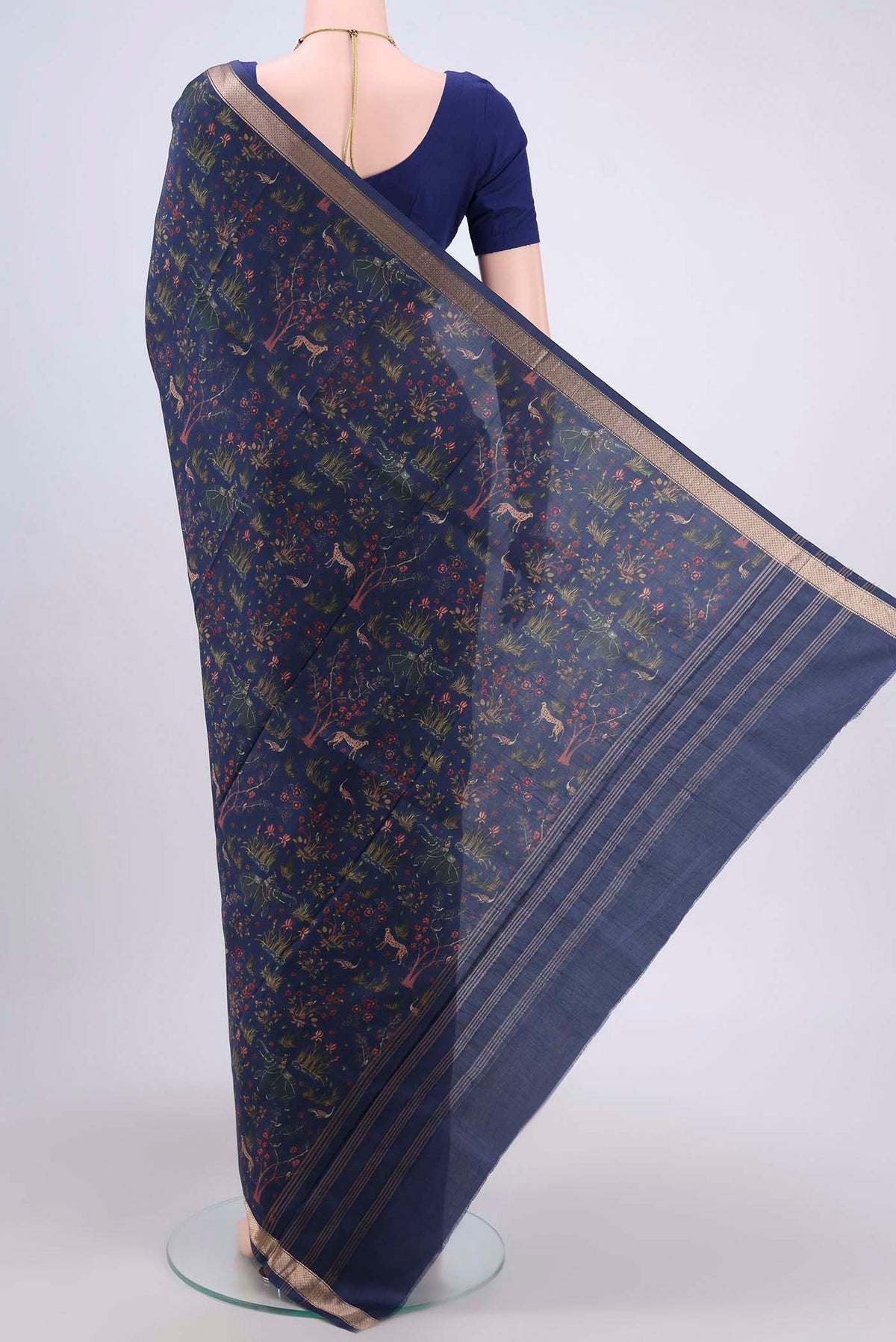Flat view of Navy Blue Printed Silk Saree with Printed design on the body and Printed Border. 