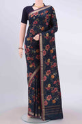 Navy Blue Printed Silk Saree with Floral Print on the body and Zari Border displayed on a mannequin