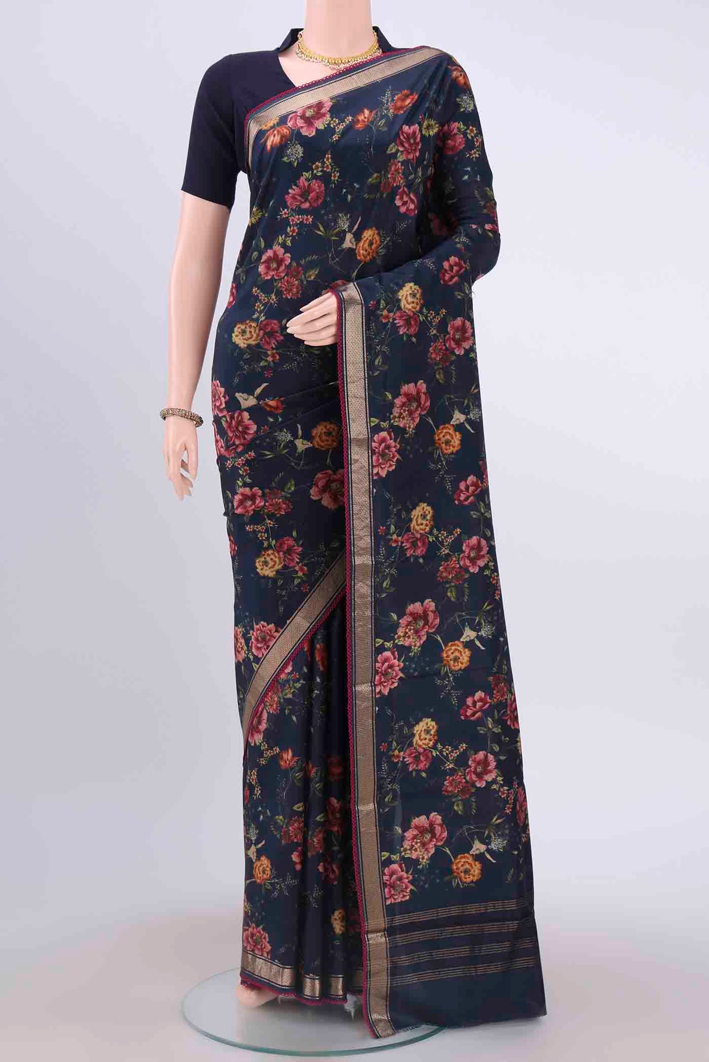 Navy Blue Printed Silk Saree with Floral Print on the body and Zari Border displayed on a mannequin