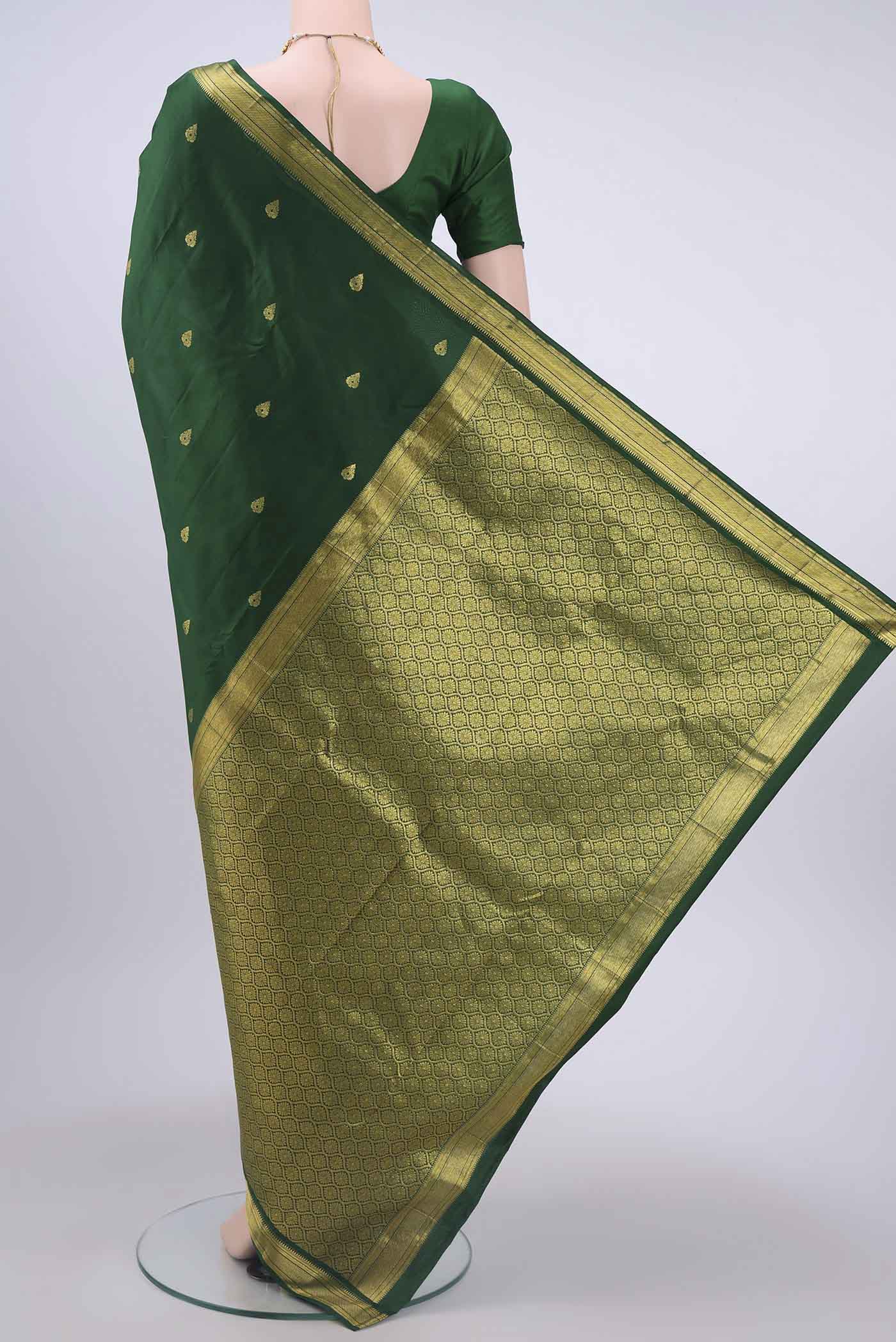 Flat view of Bottle Green Nangavalli Silk [ Salem ] Saree with Zari Butta on the body and Zari Border