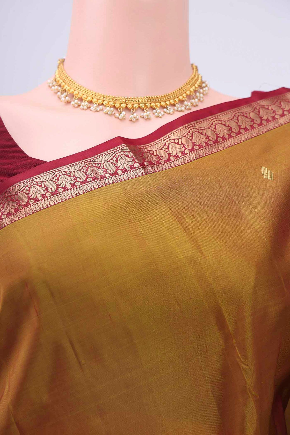 Border image of Mustard Kanchipuram Silk Saree with Zari Butta on the body and Zari Border