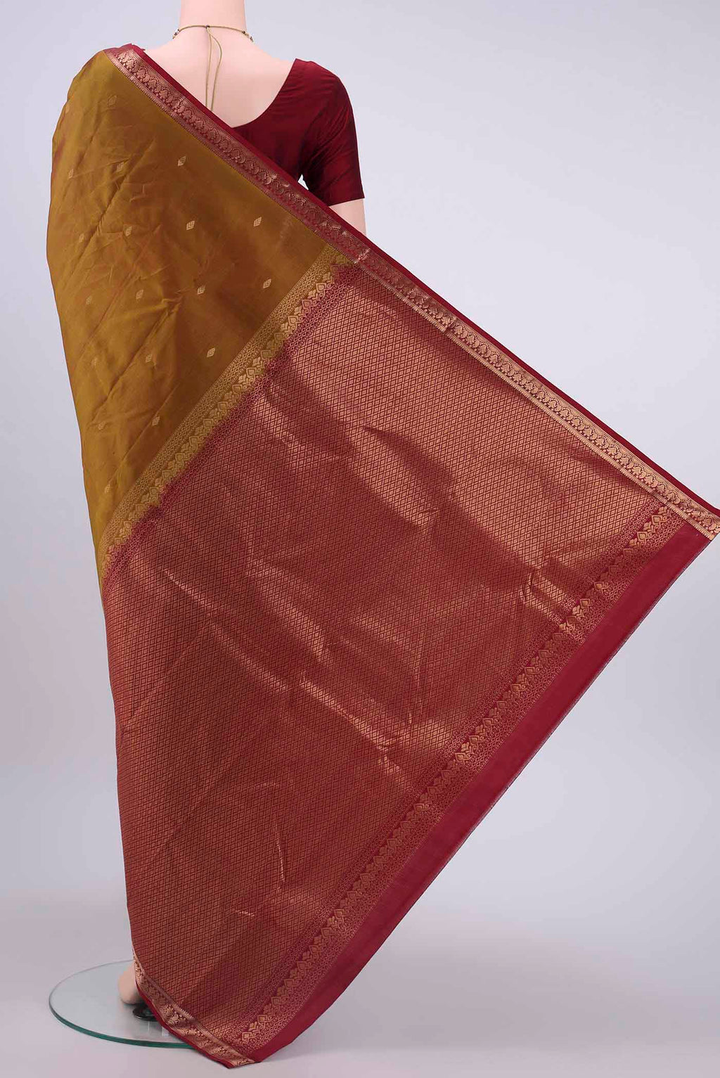 Flat view of Mustard Kanchipuram Silk Saree with Zari Butta on the body and Zari Border