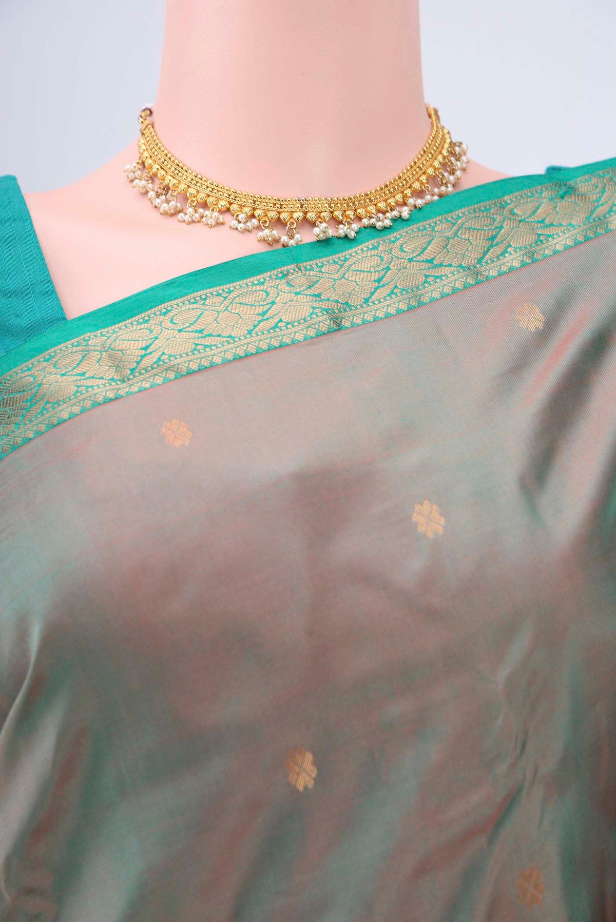 Border image of Green with Coral Color Kanchipuram Silk Saree with Zari Butta on the body and Zari Border