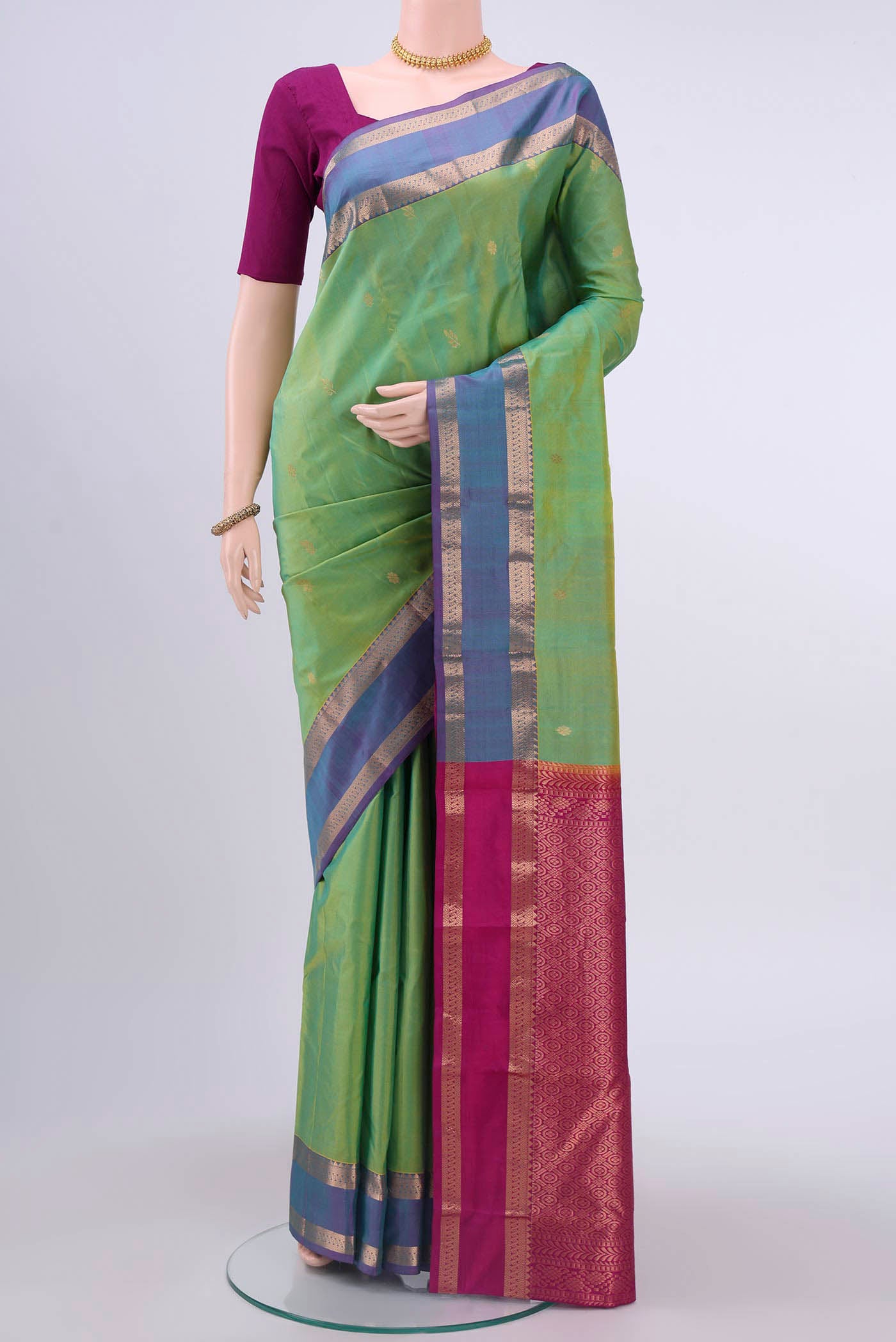 Light Green Nangavalli Silk [ Salem ] Saree with Zari Butta on the body and Zari Border displayed on a mannequin
