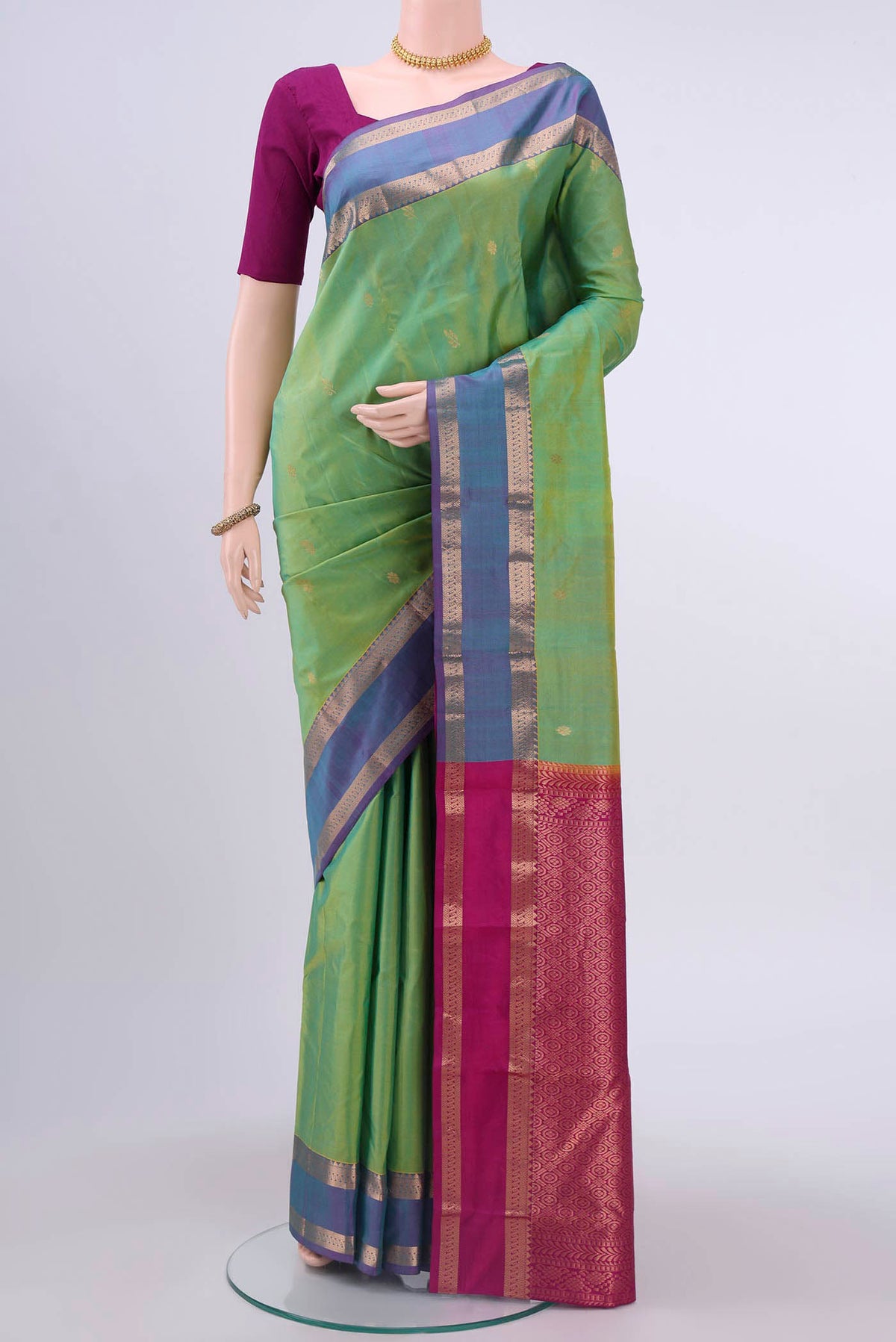 Light Green Nangavalli Silk [ Salem ] Saree with Zari Butta on the body and Zari Border displayed on a mannequin